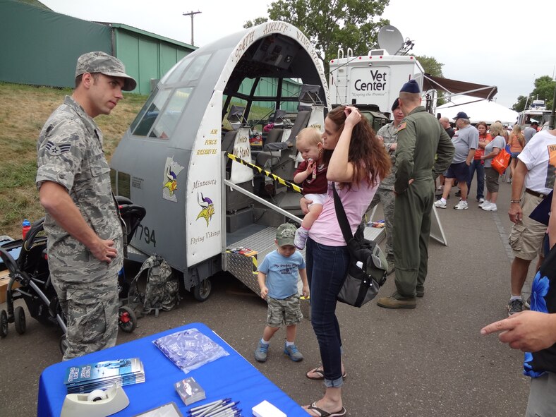 Senior Airman Trevor Saylor, 934th Airlift Wing Public Affairs, talks about the 934th Airlift Wing with Fairgoers. (Air Force Photo/Paul Zadach)



