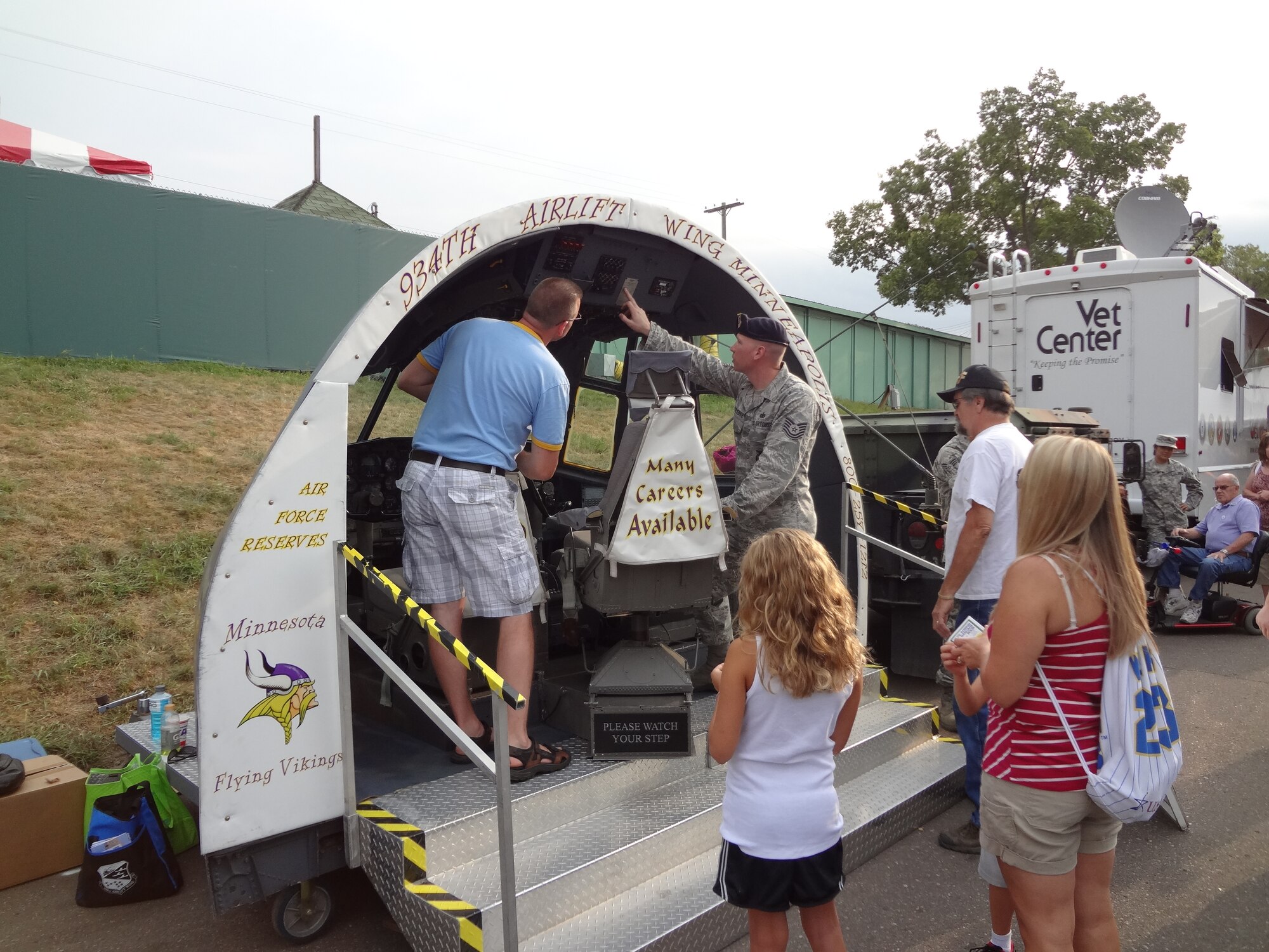 Tech. Sgt. Ron Blackledge, 934th Security Forces Squadron, talks about the 934th flight deck display with Fair visitors. (Air Force Photo/Paul Zadach)



