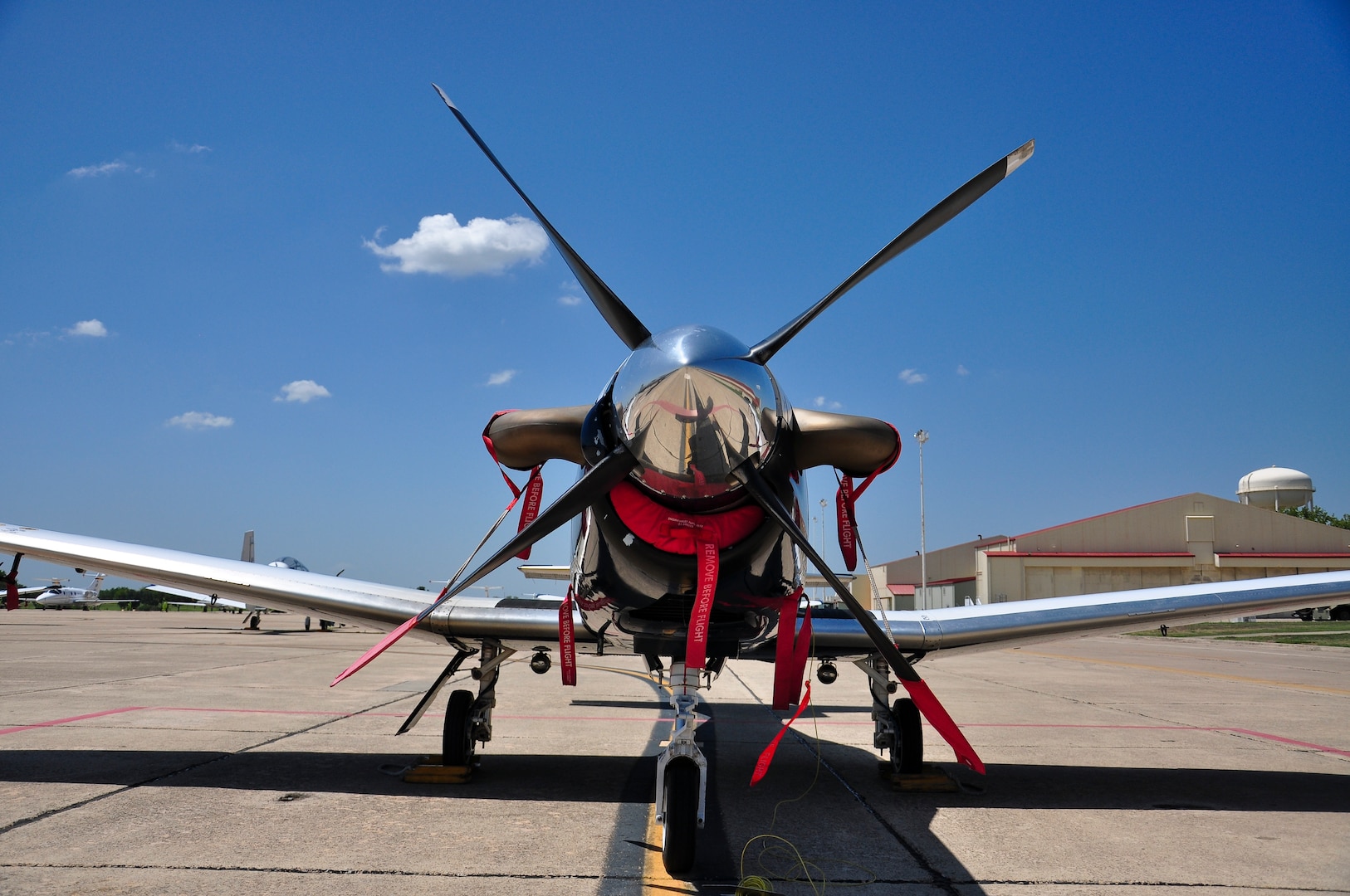 A T-6 Texan II from the 479th Flying Training Group at Naval Air Station Pensacola, Fla., sits on the south ramp at Joint Base San Antonio-Randolph, Texas, August 28, 2012. The 479th FTG is a geographically separated unit of the 12th Flying Training Wing and hosts Combat Systems Officer training for the U.S. Air Force. The 479th FTG flew 33 aircraft to Randolph in anticipation of Tropical Storm Isaac. (U.S. Air Force Photo by 2nd Lt. Keenan D. Kunst)