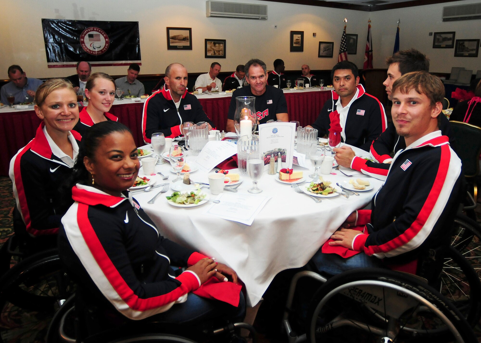 ROYAL AIR FORCE LAKENHEATH, England -- Members of the U.S. Paralympics team enjoy dinner at Eagles Landing as part of their send-off Aug. 23, 2012. More than 50 U.S. Paralympians and hopefuls honed their skills and made final preparations here Aug. 18 through 25 for competition in the London 2012 Paralympic Games. (U.S. Air Force photo by Senior Airman Lausanne Morgan)