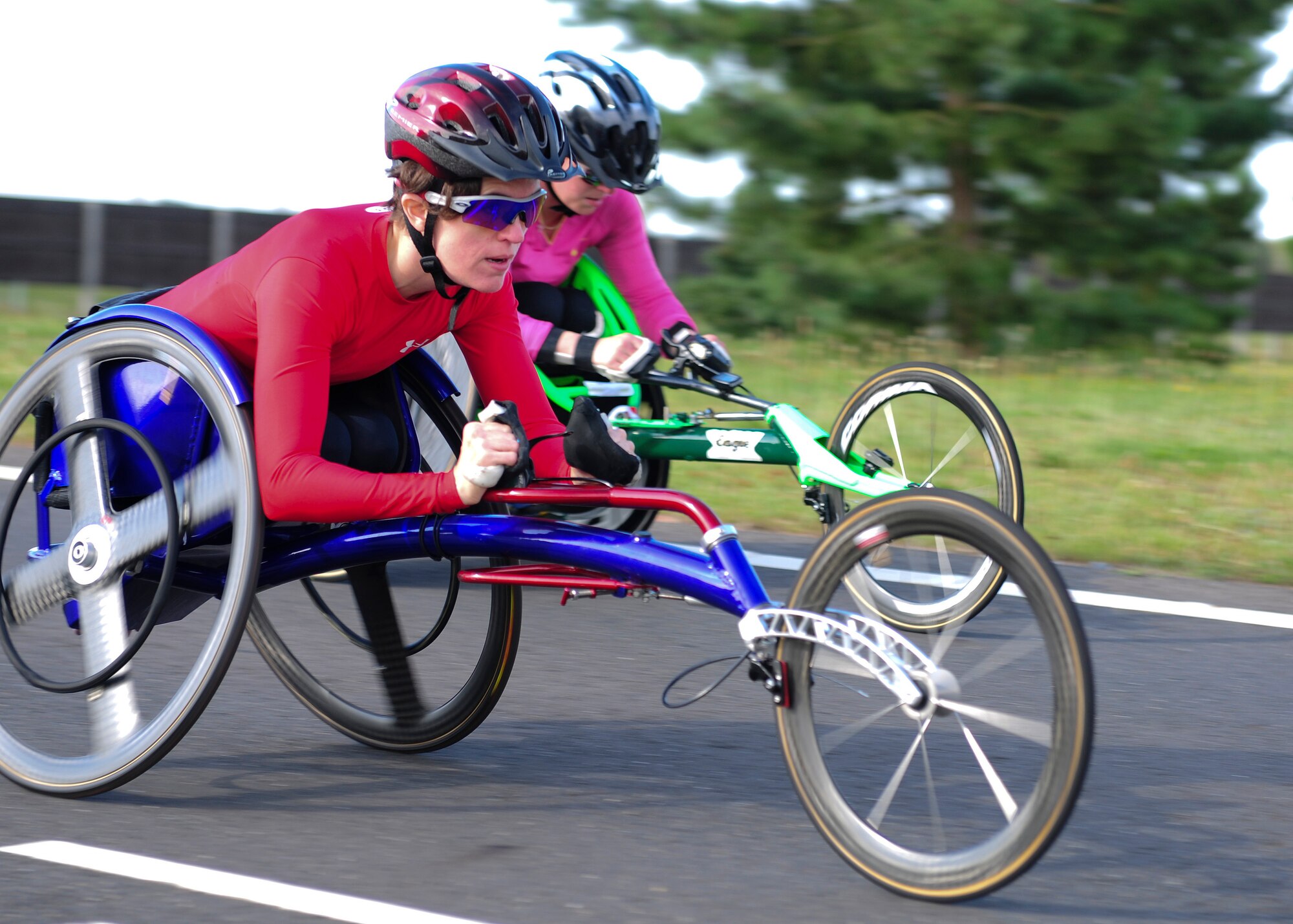 ROYAL AIR FORCE LAKENHEATH, England -- U.S. Paralympians, Kerry Morgan (left) and Cassie Mitchell, train on the perimeter road Aug. 23, 2012. More than 50 U.S. Paralympians and hopefuls honed their skills and made final preparations here Aug. 18 through 25 for competition in the London 2012 Paralympic Games. (U.S. Air Force photo by Senior Airman Lausanne Morgan)