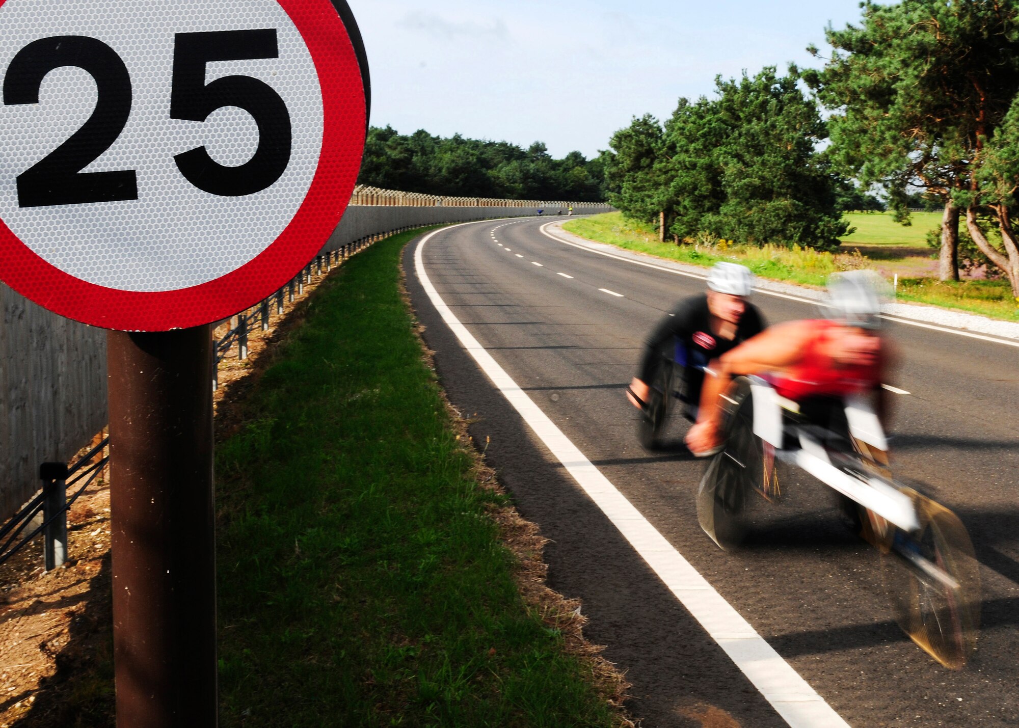 ROYAL AIR FORCE LAKENHEATH, England -- Members of the U.S. Paralympics team train on the perimeter road Aug. 23, 2012. More than 50 U.S. Paralympians and hopefuls honed their skills and made final preparations here Aug. 18 through 25 for competition in the London 2012 Paralympic Games. (U.S. Air Force photo by Senior Airman Lausanne Morgan)
