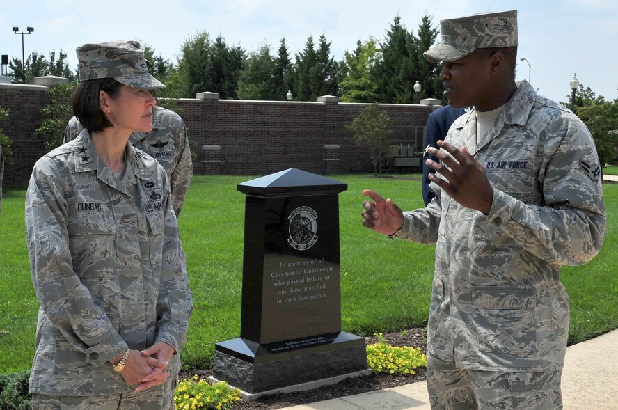 Air Force District of Washington Commander Maj. Gen. Sharon K.G. Dunbar listens to Airman 1st Class Kevin Walker, U.S. Air Force Honor Guard ceremonial guardsman, describe the duties of the firing team party during a tour of the honor guard compound Aug. 24 on Joint Base Anacostia-Bolling, Washington, D.C. The 11th Operations Group hosted an immersion tour for AFDW leadership, demonstrating the USAF Honor Guard and Band missions and capabilities. (U.S. Air Force photo by Senior Airman Steele C. G. Britton)