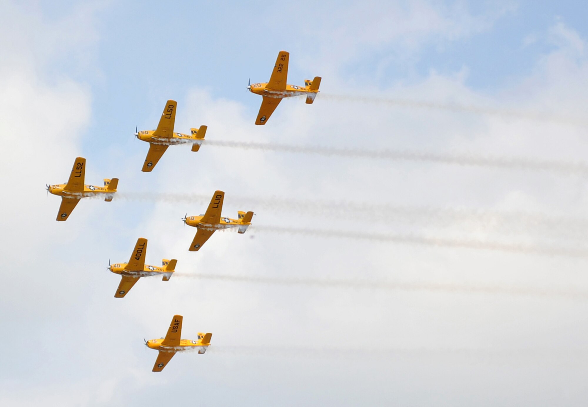 The Lima-Lima flight team takes formation at the 2012 Defenders of Freedom Open House and Air Show on Offutt Air Force Base, Neb., Aug. 26. The flagship of the Lima-Lima flight team is the T-34. (U.S. Air Force photo by Jeff W. Gates/Released)