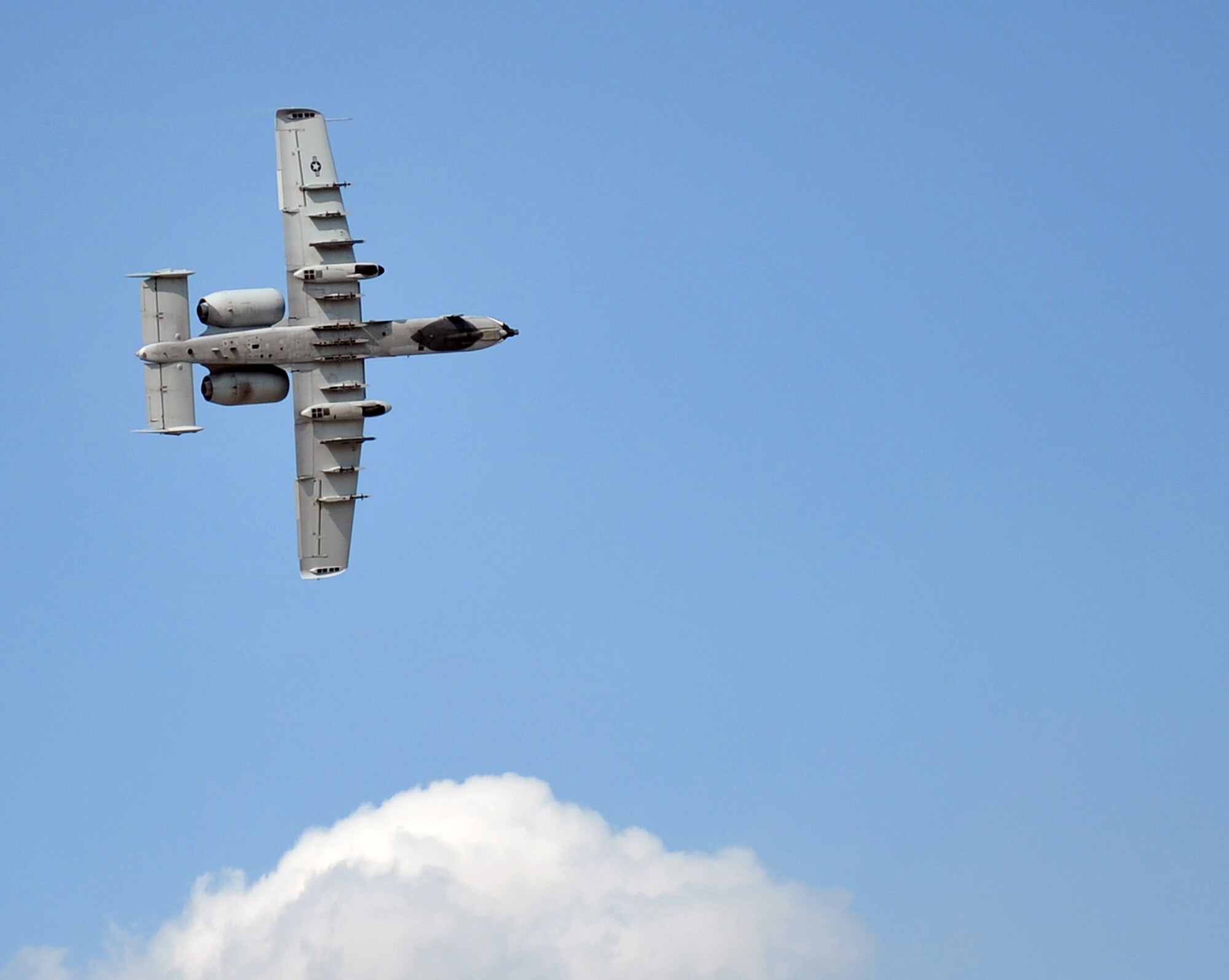 An A-10 Thunderbolt II takes flight at the 2012 Defenders of Freedom Open House and Air Show on Offutt Air Force Base, Neb., Aug. 26. The A-10 was a key part of the heritage flight for the air show. (U.S. Air Force photo by Jeff W. Gates/Released)