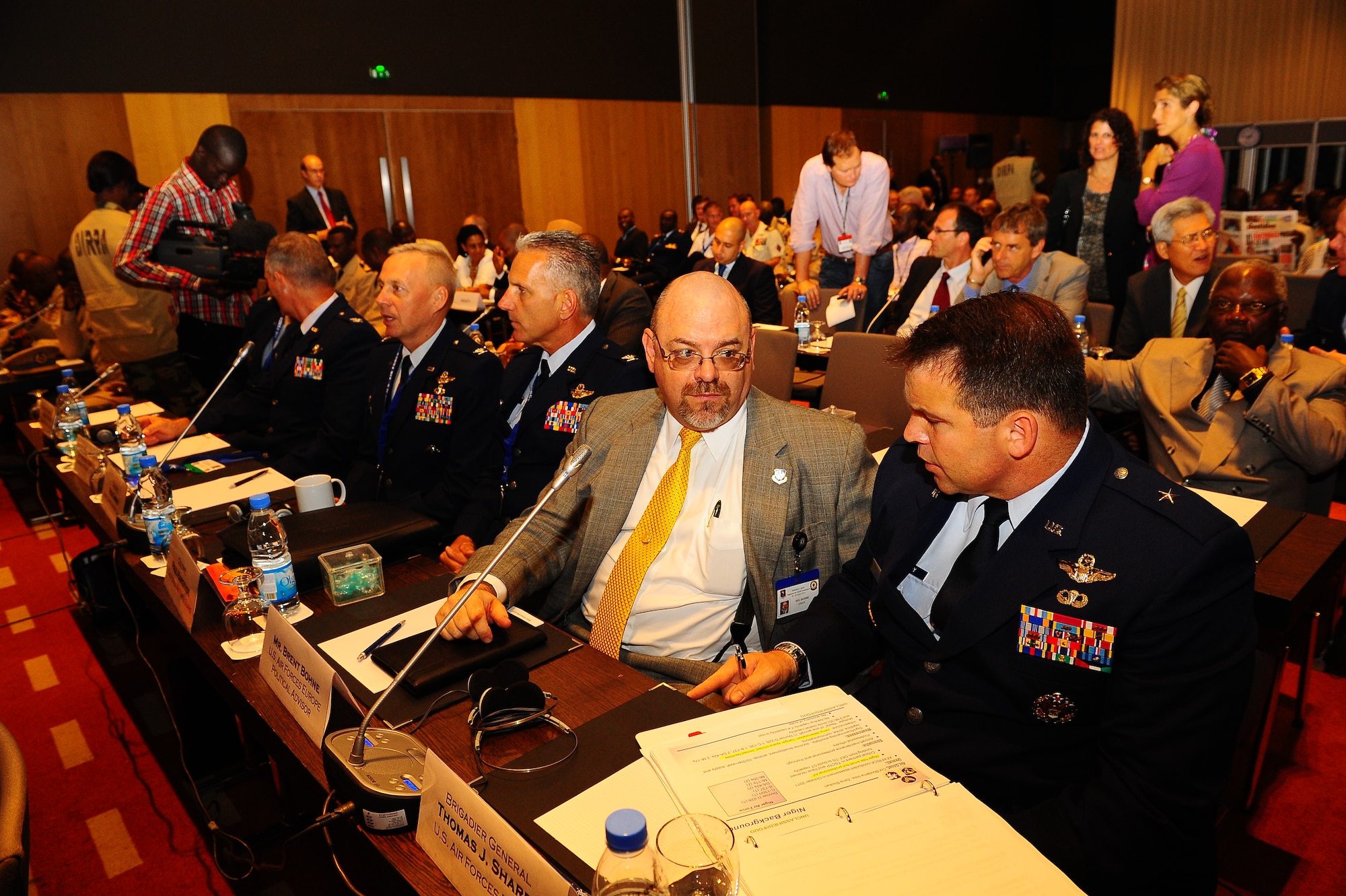 Brig. Gen. Thomas Sharpy, director of plans, programs and analyses for headquarters U.S. Air Forces in Europe and Africa, talks with Brent Bohne, political advisor, prior to the start of the Regional Air Chief Conference Aug. 28, 2012, in Dakar, Senegal. The conference was used to promote regional partnerships in Northern and Western Africa to find African solutions to African problems. (U.S. Air Force photo/Staff Sgt. Travis Edwards)
