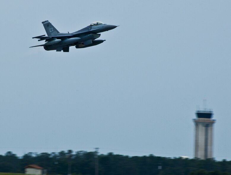 A 96th Test Wing F-16 lifts off from Eglin Air Force Base, Fla., Aug 27.  The 96th and the 53rd Wing evacuated their aircraft due to the impending arrival of Hurricane Isaac.  The Wings’ F-16s flew to Shaw Air Force Base, S.C., and the F-15s flew to Seymour Johnson Air Force Base, N.C.  (U.S. Air Force photo/Samuel King Jr.)  