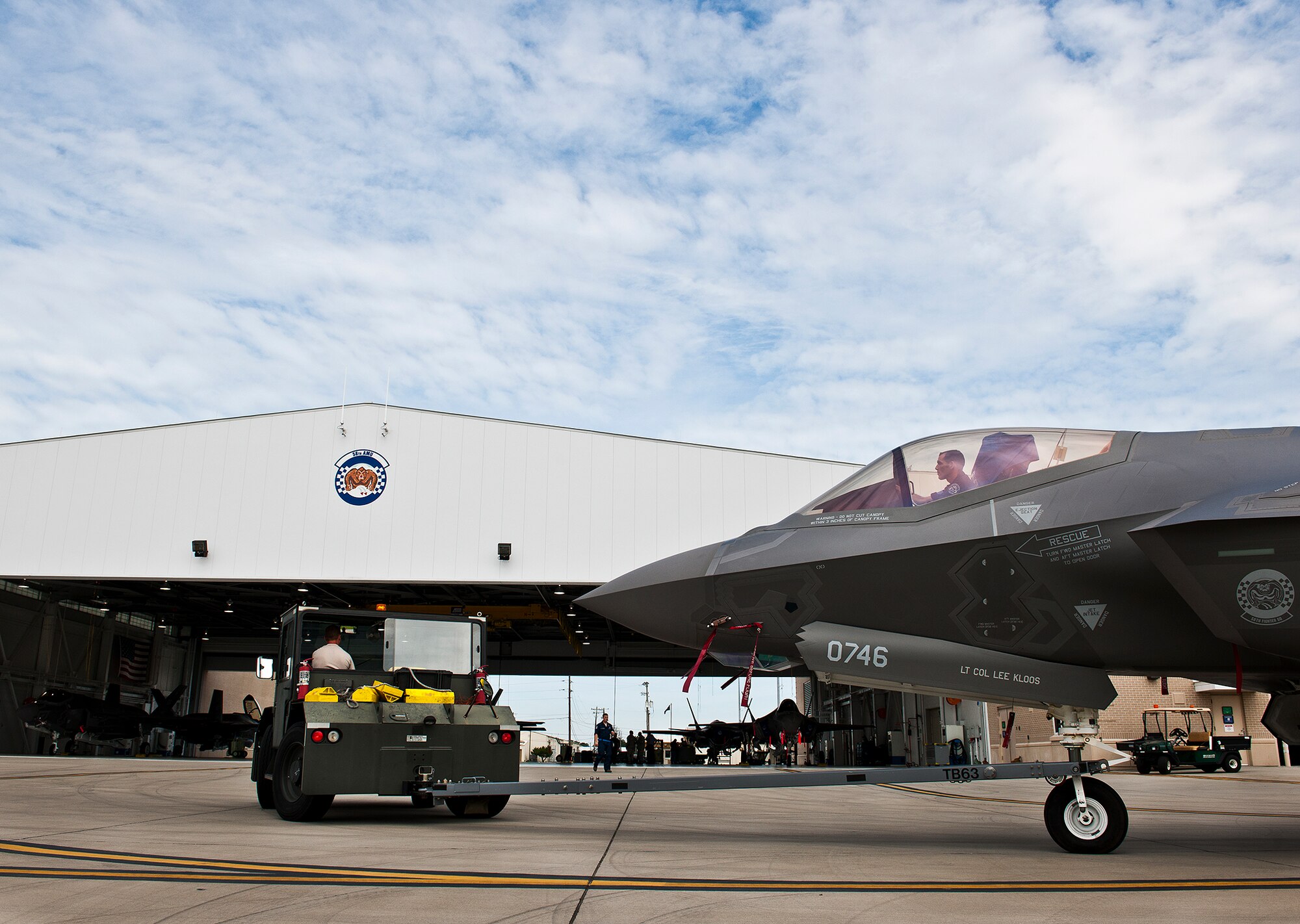 Members of the 33rd Maintenance Squadron move an Air Force F-35A Lightning II off the flightline and into a hangar at Eglin Air Force Base, Fla., Aug. 27.  The 33rd Fighter Wing’s joint strike fighters were moved into hangars in preparation for the arrival of Hurricane Isaac.  The 58th Fighter Squadron hangar held nine A models, while the Marine Fighter Attack Squadron 501 hangar stored the 10 B models.  (U.S. Air Force photo/Samuel King Jr.)  