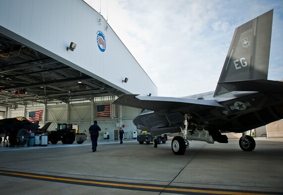 A 33rd Maintenance Squadron Airman backs in an Air Force F-35A Lightning II into the 58th Fighter Squadron hangar at Eglin Air Force Base, Fla., Aug. 27.  The 33rd Fighter Wing’s joint strike fighters were moved into hangars in preparation for the arrival of Hurricane Isaac.  The 58th hangar held nine A models, while the Marine Fighter Attack Squadron 501 hangar stored the 10 B models.  (U.S. Air Force photo/Samuel King Jr.)  