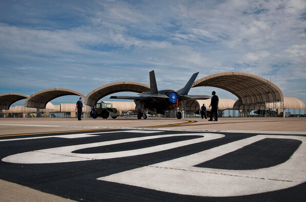 Members of the 33rd Maintenance Squadron move an Air Force F-35A Lightning II off the flightline and into a hangar at Eglin Air Force Base, Fla., Aug. 27.  The 33rd Fighter Wing’s joint strike fighters were moved into hangars in preparation for the arrival of Hurricane Isaac.  The 58th Fighter Squadron hangar held nine A models, while the Marine Fighter Attack Squadron 501 hangar stored the 10 B models.  (U.S. Air Force photo/Samuel King Jr.)  