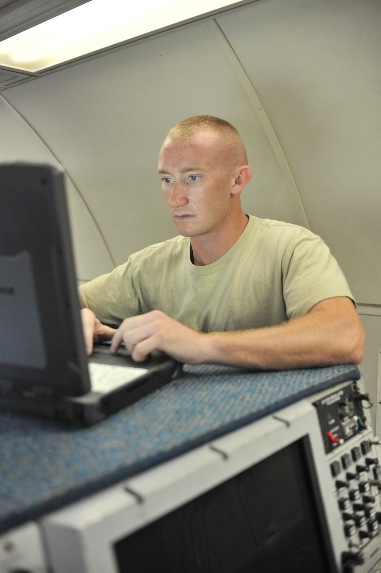SOUTHWEST ASIA - U.S. Air Force Staff Sgt. Andrew Steeves, 380th Expeditionary Aircraft Maintenance Squadron Sentry cyber transport systems maintainer, reviews technical orders on a laptop before loading a program Aug. 27, 2012. Steeves, a Bangor, Maine, native, is deployed to the 380th Air Expeditionary Wing from Tinker Air Force Base, Okla. (U.S. Air Force photo/Senior Airman Jared Elliott)