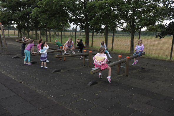 RAF ALCONBURY, United Kingdom – Children play on seesaws at the RAF Alconbury elementary school playground during lunch Aug. 27. The day was the first day of classes for students in the 501st Combat Support Wing. (U.S. Air Force photo by Master Sgt. John Barton)