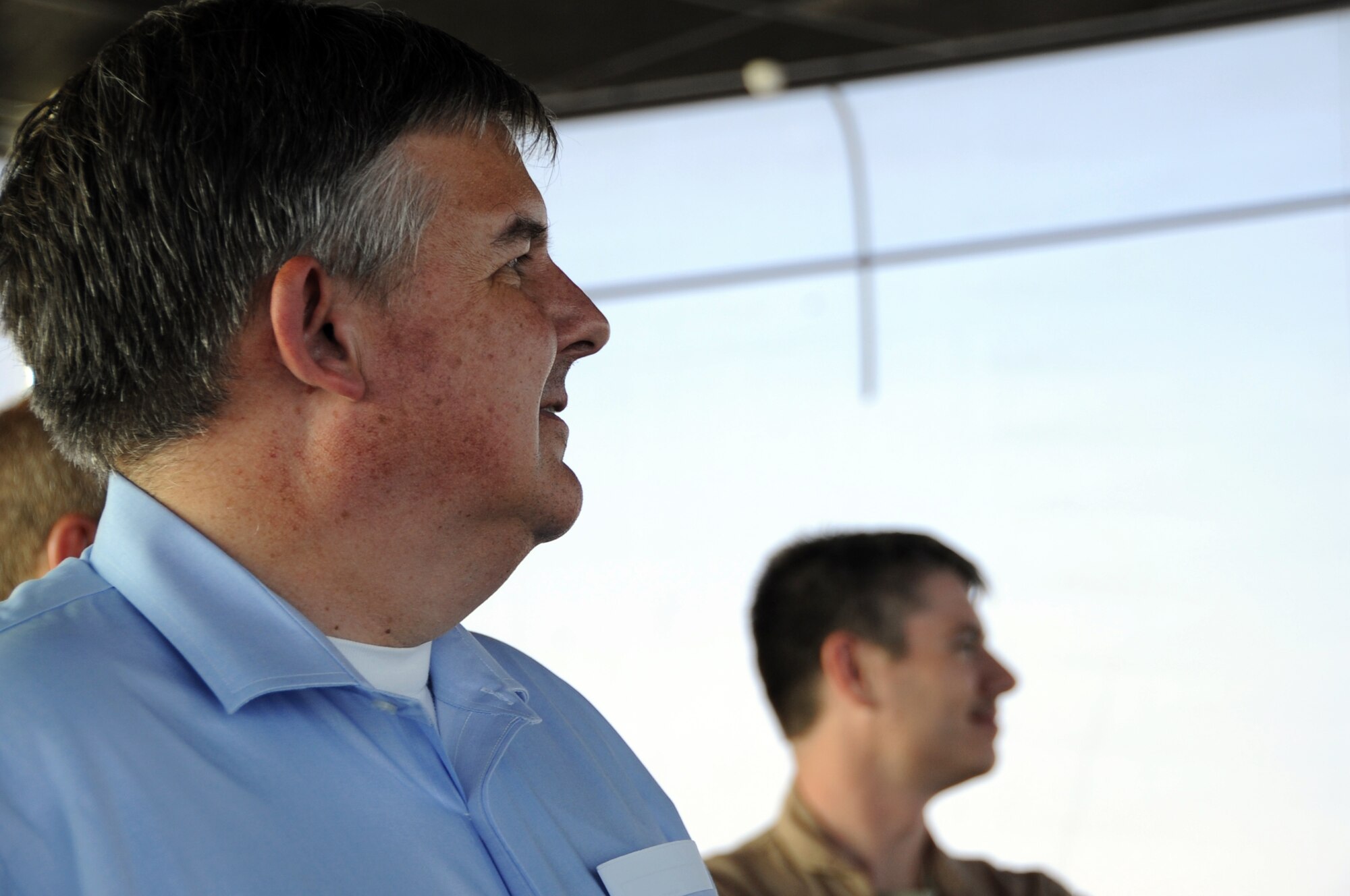 The Honorable Charles Blanchard, General Counsel of the U.S. Department of the Air Force, watches flight operations inside the control tower in Southwest Asia, August 20, 2012. During his visit to Southwest Asia, Blanchard and his colleagues were conducting a tour throughout the area of responsibility seeking firsthand knowledge of legal issues the commands routinely address.  (U.S. Air Force photo/Staff Sgt. Sheila deVera)