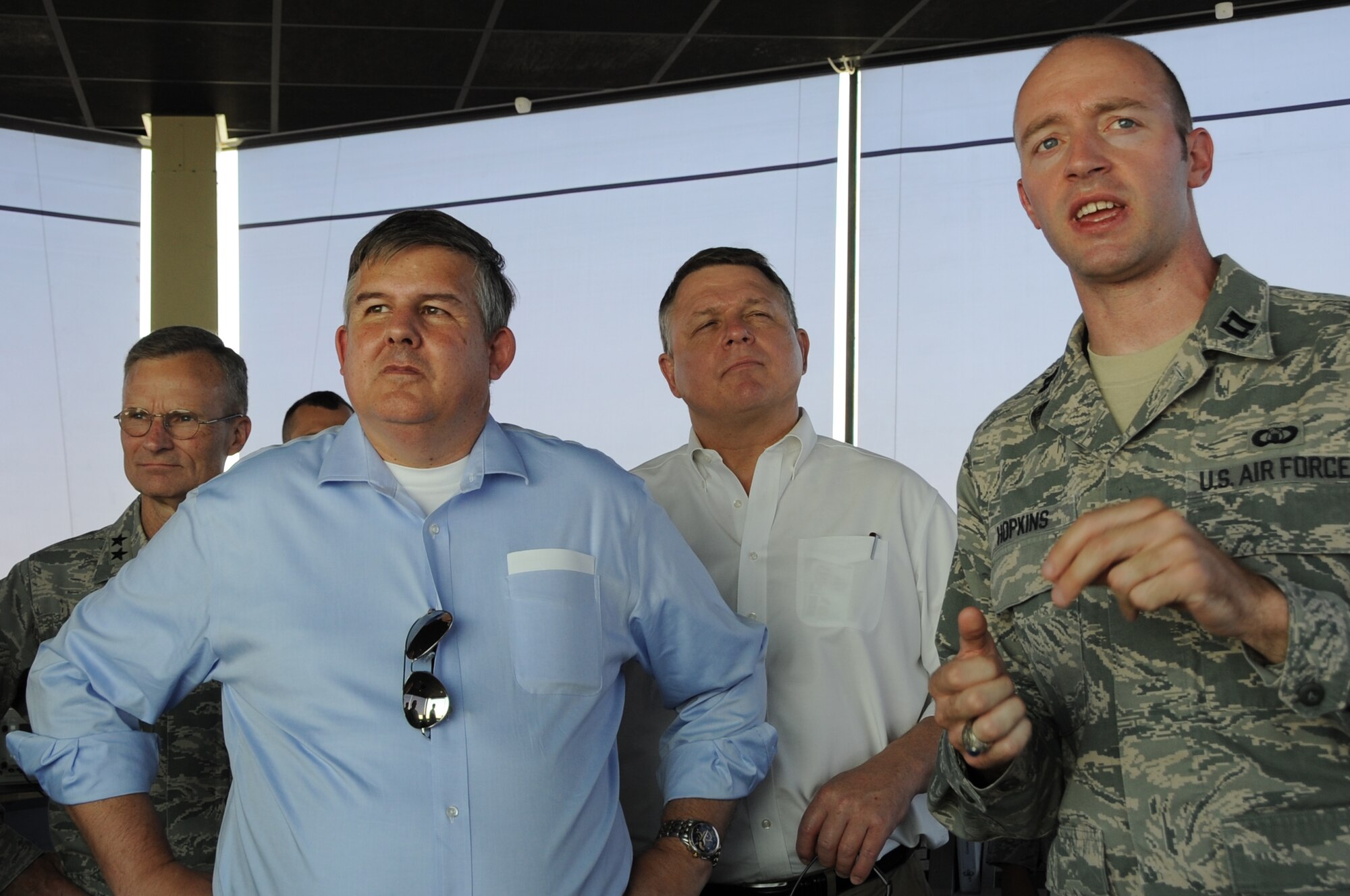 The Honorable Charles Blanchard (front to back), General Counsel of the U.S. Department of the Air Force, Mr. Michael Zehner, Deputy General Counsel, and Maj. Gen. Steven Lepper, Deputy Judge Advocate General, listen to Capt. Matthew Hopkins explain flight operations in Southwest Asia, August 20, 2012.  During his visit to Southwest Asia, Blanchard and his colleagues were conducting a tour throughout the area of responsibility seeking firsthand knowledge of legal issues the commands routinely address.  Hopkins is assigned to the 379th Expeditionary Operations Support Squadron. (U.S. Air Force photo/Staff Sgt. Sheila deVera)