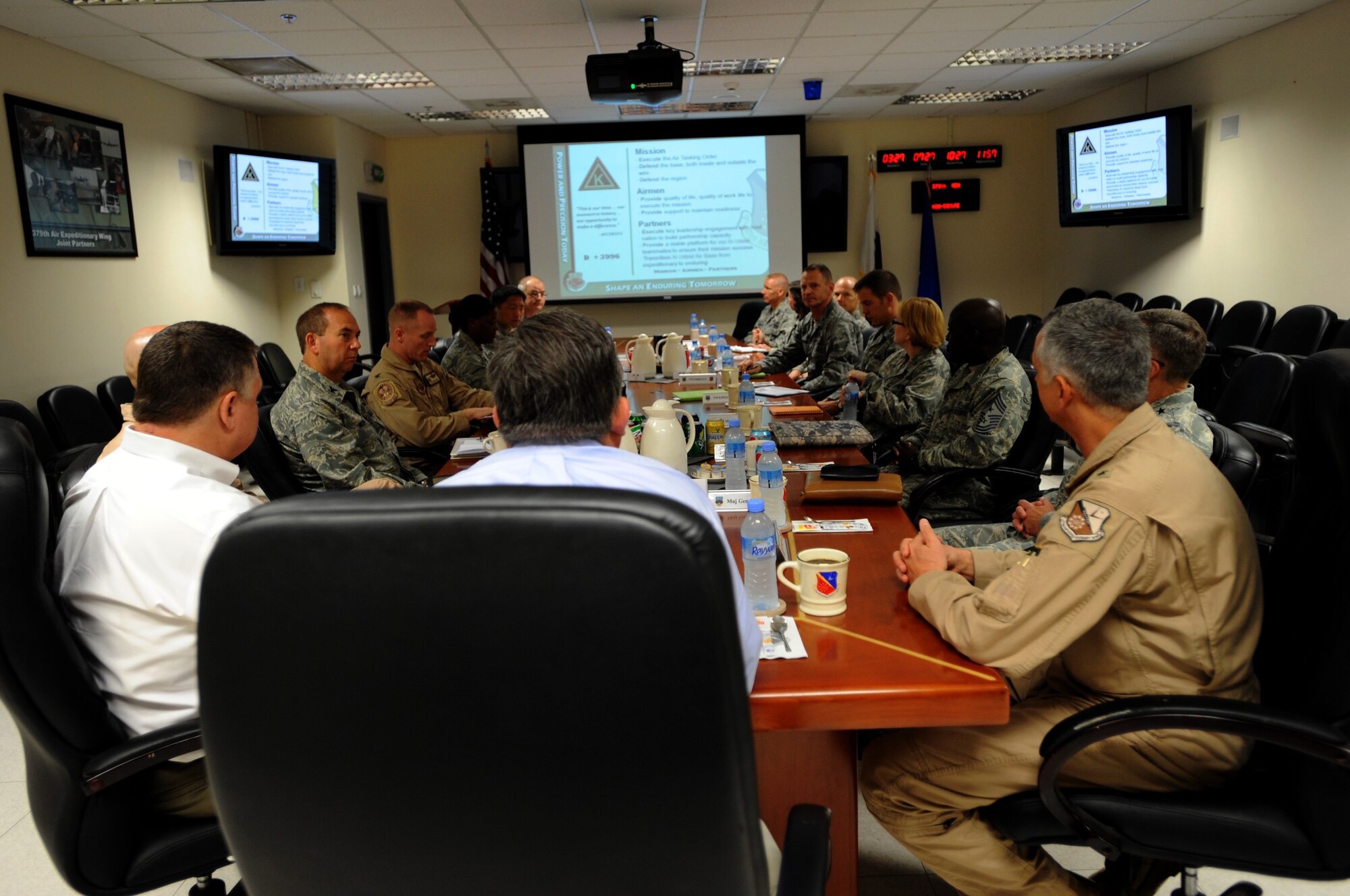 379th Air Expeditionary Wing senior leadership provided a Wing mission brief to the Honorable Charles Blanchard, General Counsel of the U.S. Department of the Air Force, August 20, 2012. During his visit to Southwest Asia, Blanchard and his colleagues were conducting a tour throughout the area of responsibility seeking firsthand knowledge of legal issues the commands routinely address.  (U.S. Air Force photo/Staff Sgt. Sheila deVera)