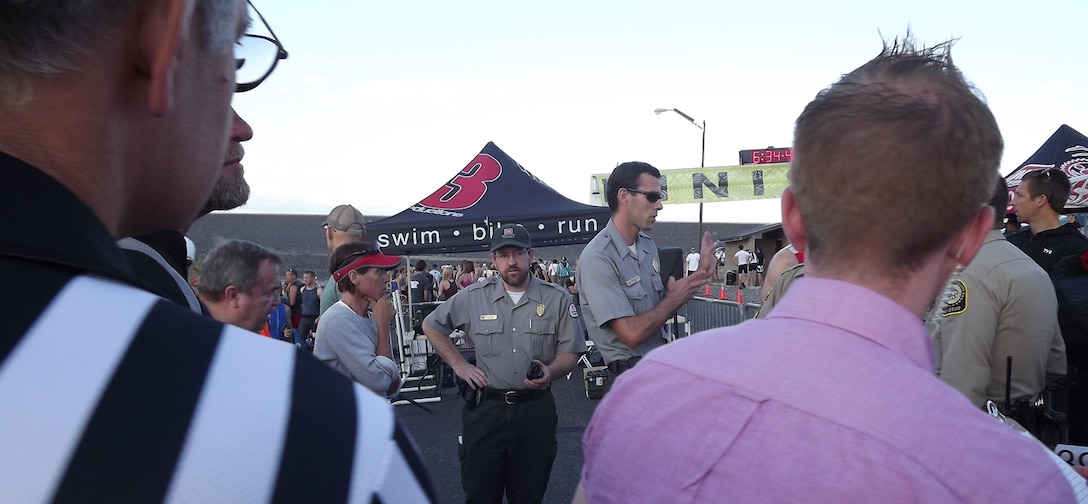 Cochiti park rangers Chris Schooley (center) and Nicholas Parks direct race participants and answer questions about the race and the Corps' Cochiti Lake project.