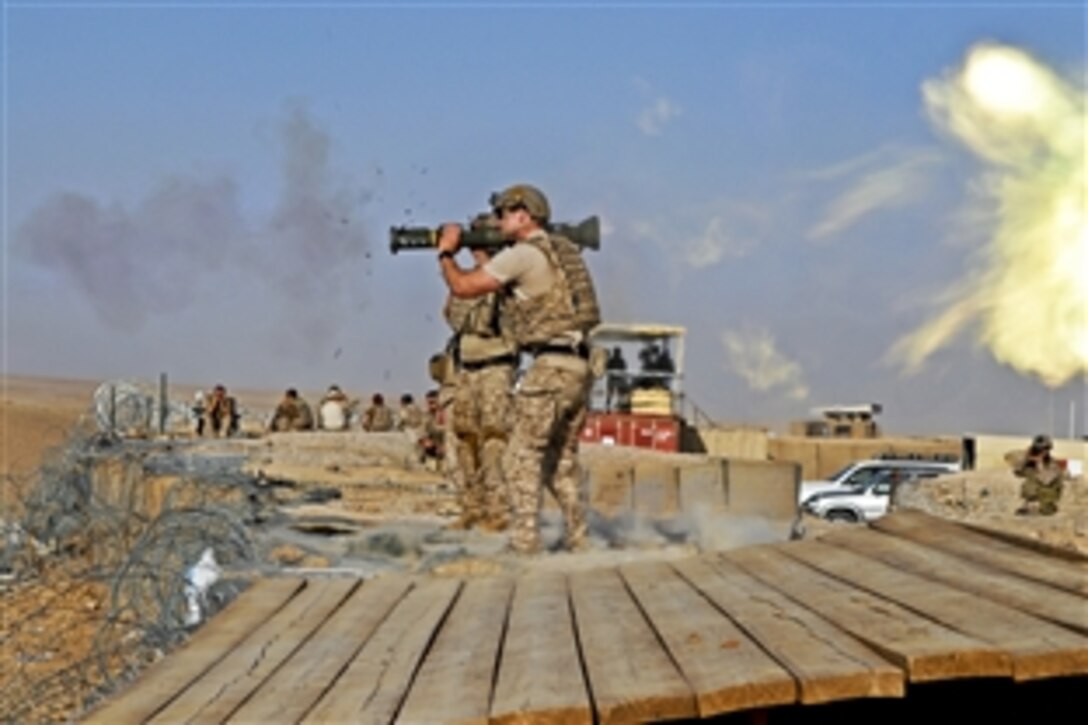 A special operations forces soldier fires an AT-4 shoulder-fired rocket launcher at the heavy weapons firing range on a base in the Tarin Kowt district in Afghanistan's Uruzgan province, Aug. 22, 2012. The soldier is assigned to Special Operations Task Force Southeast