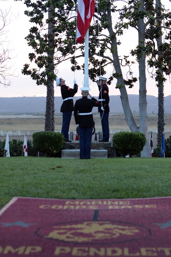 Marines lower the flag at the historical Santa Margarita Ranch House during Camp Pendleton’s Evening Colors Ceremony, Aug. 28.