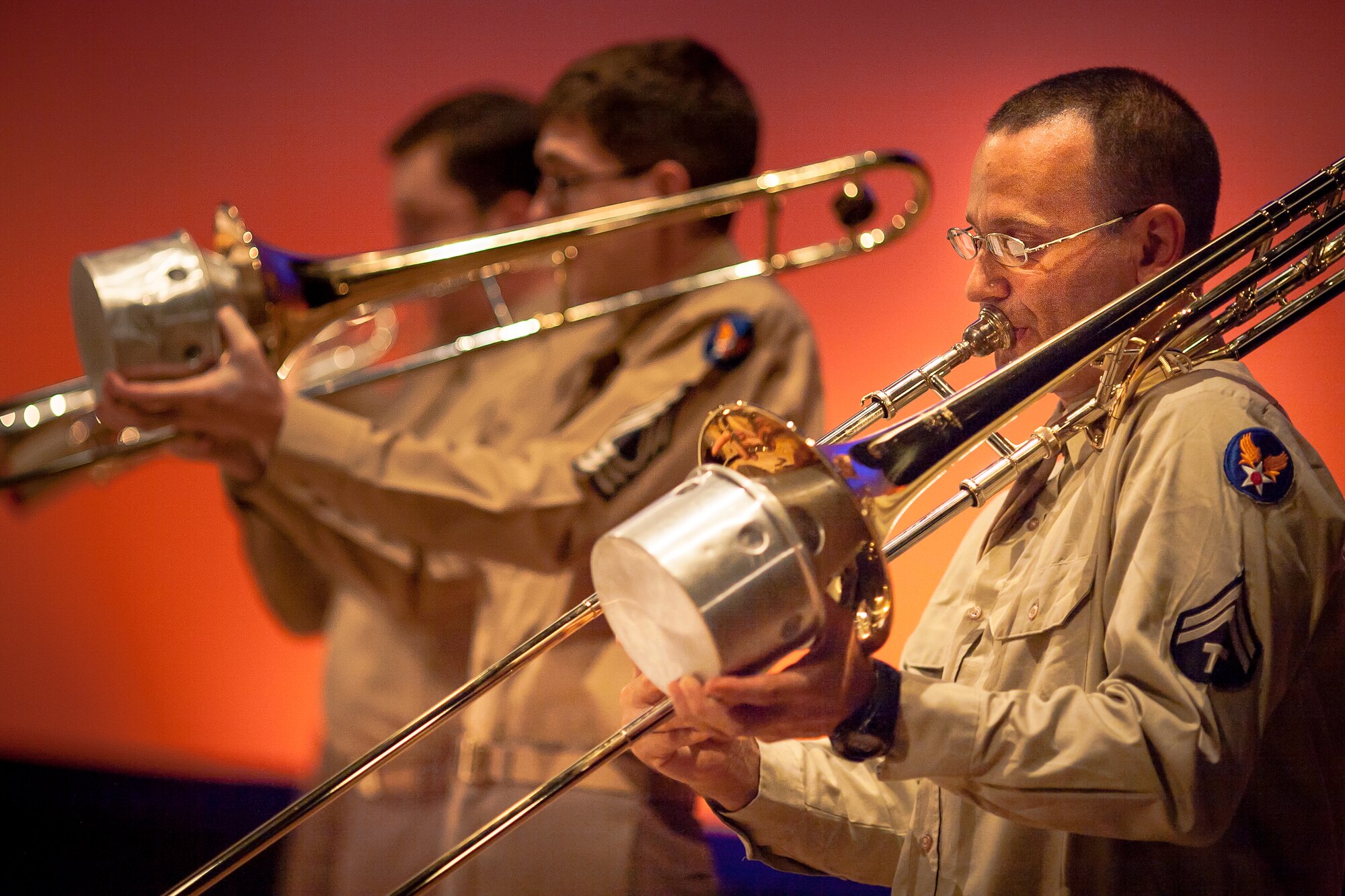 FUSSA CITY, Japan -- Tech. Sgt. John Garcia, right, Heritage of America Band trombonist, joins the Band of the Pacific-Asia at the Fussa-Yokota Friendship Concert, Fussa City, Japan on Aug. 28, 2012. Garcia played the trombone for Pacific Showcase to ensure a complete horn section while the Band of the Pacific-Asia awaits the last musician to arrive to Yokota. (U.S. Air Force photo by Staff Sgt. Josh Voyles)