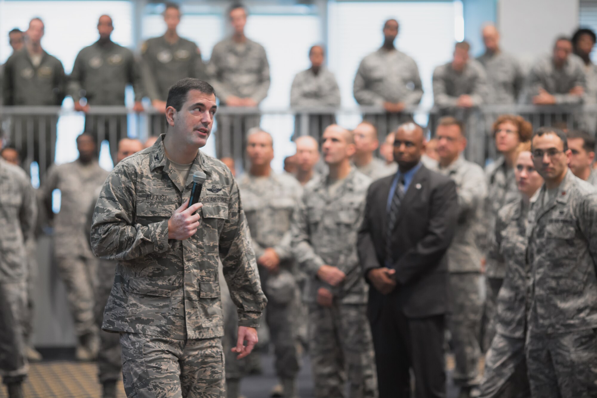 YOKOTA AIR BASE, Japan -- Col. Mark August, 374th Airlift Wing commander, talks about his vision to the audience during a commander's call, Aug. 30, 2012 at Yokota Air Base, Japan. August outlined his goals and expectations along with congratulating the wing on recent successes. (U.S. Air Force photo/Osakabe Yasuo)