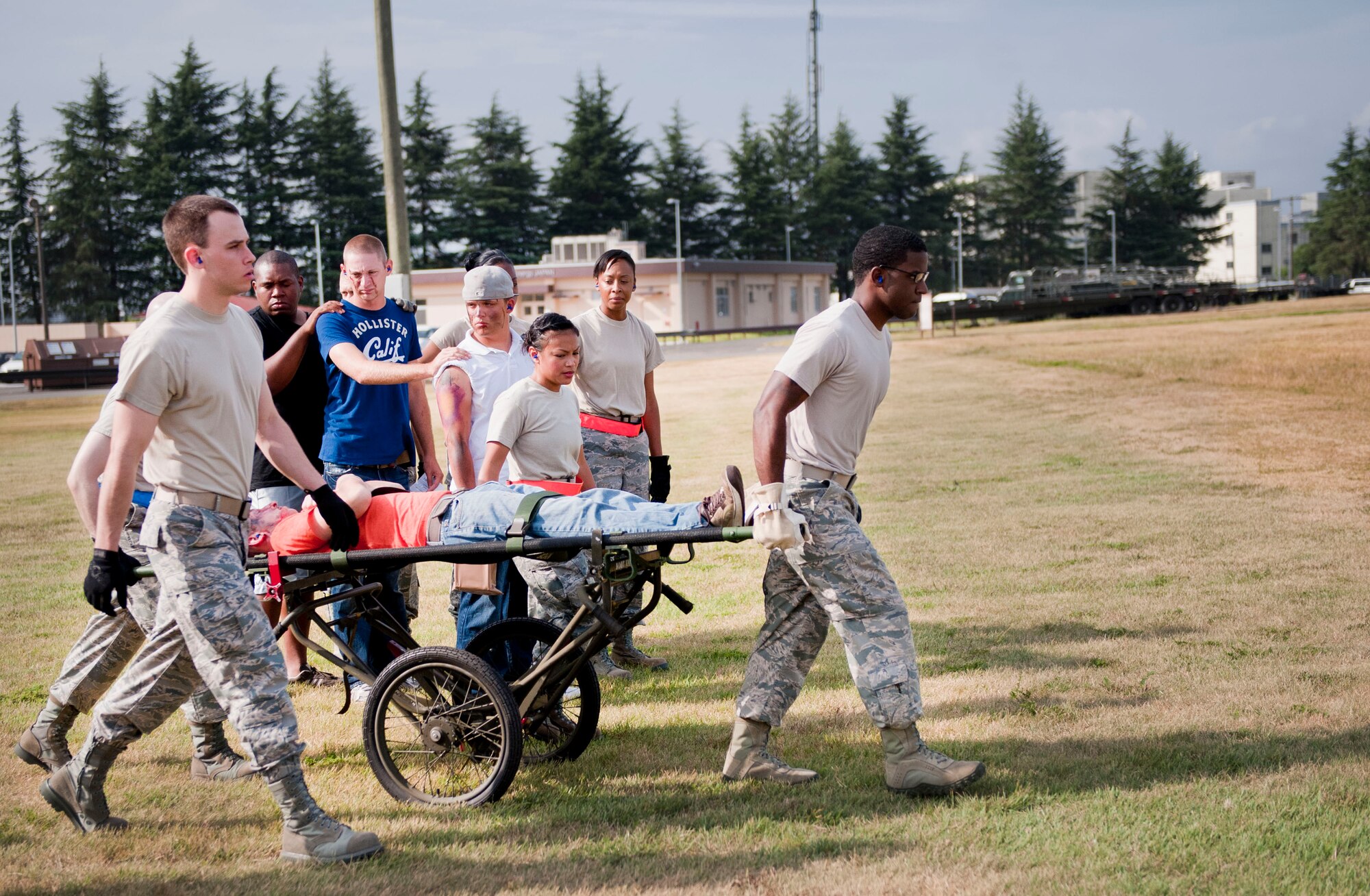 YOKOTA AIR BASE, Japan -- Airmen from the 374th Medical Group transport simulated patients to a UH-1N Iroquois during a joint Army and Air Force medical exercise at Yokota Air Base, Japan, Aug. 28, 2012. The 374 MDG set up a Mobile Aeromedical Staging Facility to care for patients in response to a simulated natural disaster. (U.S. Air Force photo by Airman 1st Class Krystal M. Garrett)