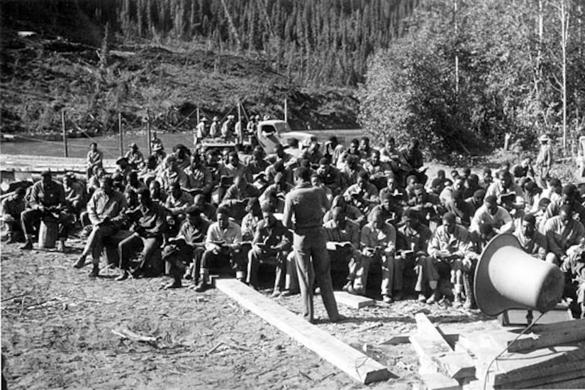 An Army engineer unit chaplain leads a worship service during the building of the Alaska highway in 1942. (Courtesy photo)