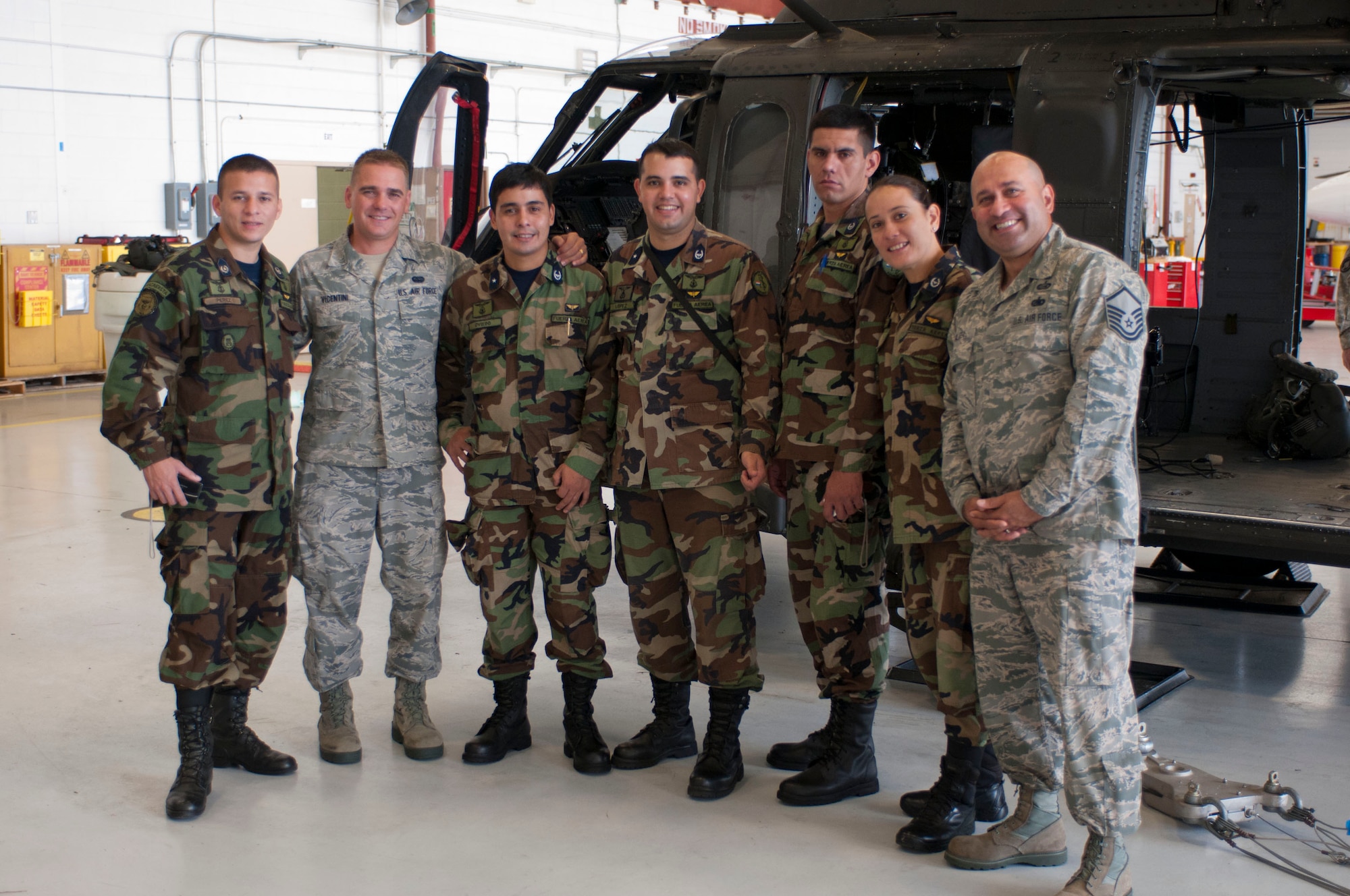 From left to right: 2nd Lt. Jose Miguel Perez Baez, Senior Airman Luiz Vicentini, 1st Lt. Milciades Antonio Oviedo Peralta, 1st Lt. Diego Armando Lopez Galeano, 2nd Lt. Milder David Mosqueira Roa, 2nd Lt. Lilian Rossana Mosqueira Romero, and Master Sgt. Carlos Alicea. (Air National Guard photo by Master Sgt. Aaron Smith/Released)