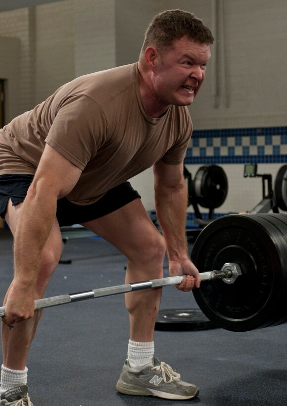 U.S. Air Force Senior Master Sgt. Robert Disney, Air Combat Command pararescue team leader, lifts 440-pounds of weight during his workout inside the “Warrior Zone” at Langley Air Force Base, Va., Aug. 29, 2012. The room is designed for athletes who perform advanced tactical fitness, using high-intensity training. (U.S. Air Force photo by Senior Airman Stephanie Rubi / Released)
