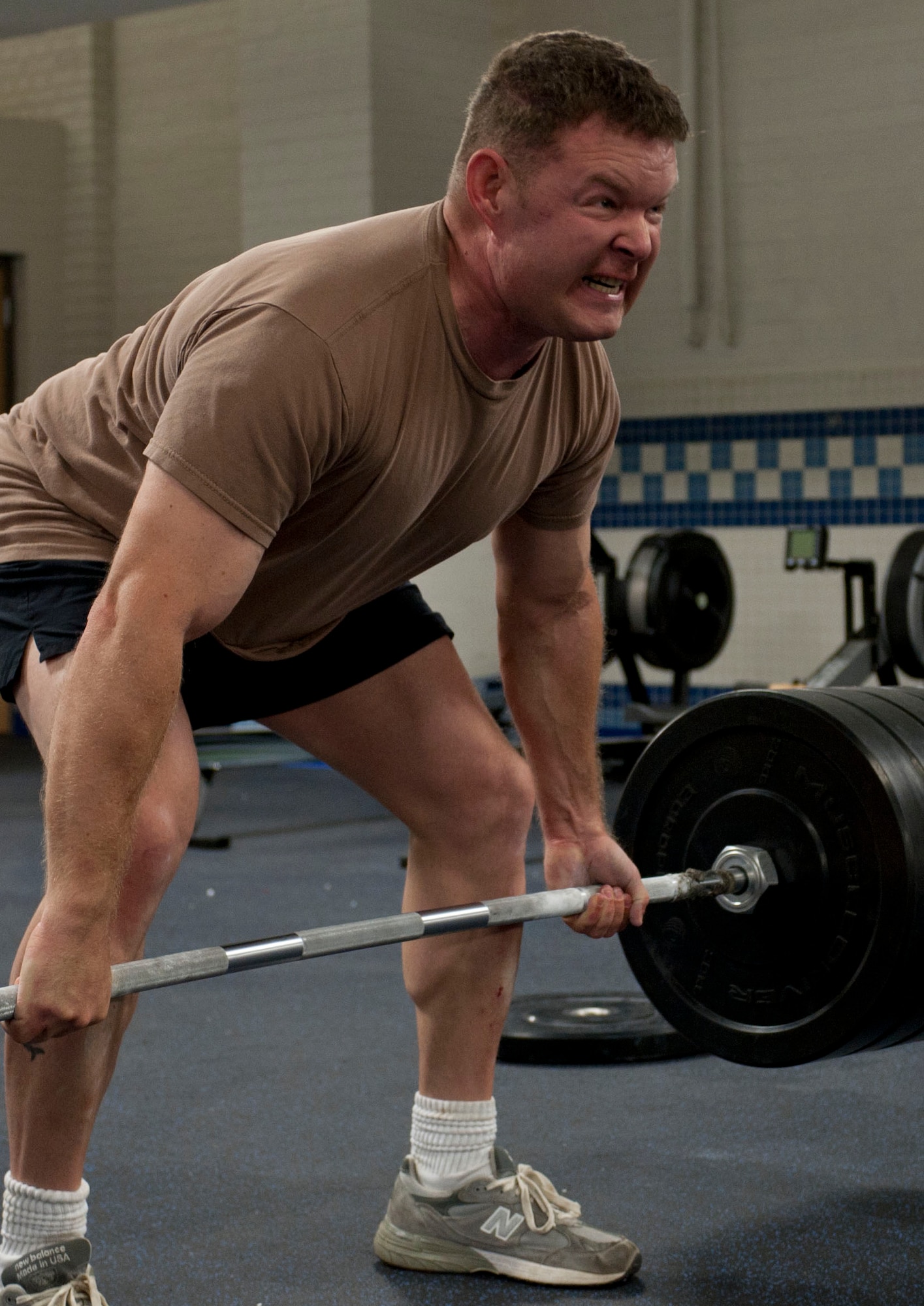 U.S. Air Force Senior Master Sgt. Robert Disney, Air Combat Command pararescue team leader, lifts 440-pounds of weight during his workout inside the “Warrior Zone” at Langley Air Force Base, Va., Aug. 29, 2012. The room is designed for athletes who perform advanced tactical fitness, using high-intensity training. (U.S. Air Force photo by Senior Airman Stephanie Rubi / Released)