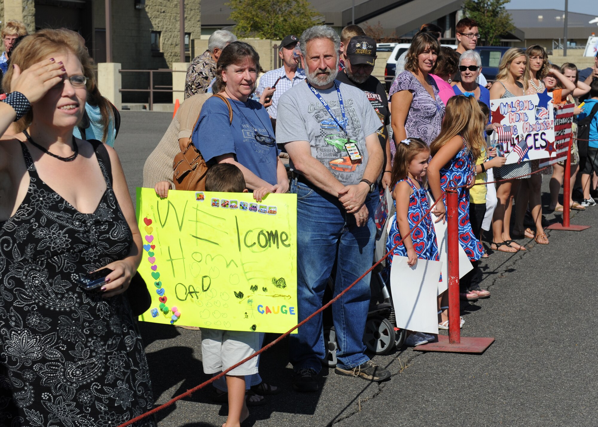 Family and friends wait for the arrival of more than 30 Airmen from the 141st Civil Engineer Squadron at Fairchild Air Force Base, Wash., Aug. 27, 2012. The Airmen are returning from a recent deployment to Afghanistan. (U.S. Air Force photo by Staff Sgt. Michael Means)