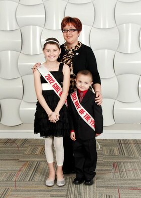 Fe Vorderlandwehr, 22nd Force Support Squadron community center director, and Leukemia and Lymphoma Society 2012 Woman of the Year, with the Girl and Boy of the Year, Mikala and Joey. Vorderlandwehr and her group managed to raise more than $58,000 towards the LLS cause. (Courtesy photo) 

