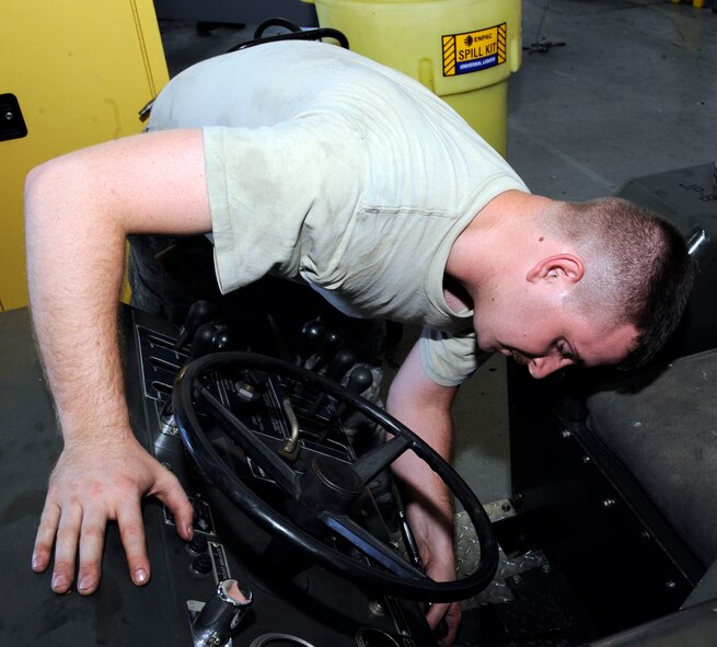Airman 1st Class Randle Taylor, 2nd Maintenance Squadron aerospace ground equipment flight, replaces a steer control valve on a MHU 83 D/E model bomb lift on Barksdale Air Force Base, La., Aug 28. The AGE flight maintains equipment and tools required to assist aircraft take-off. (U.S. Air Force photo/Airman 1st Class Andrew Moua)(RELEASED)