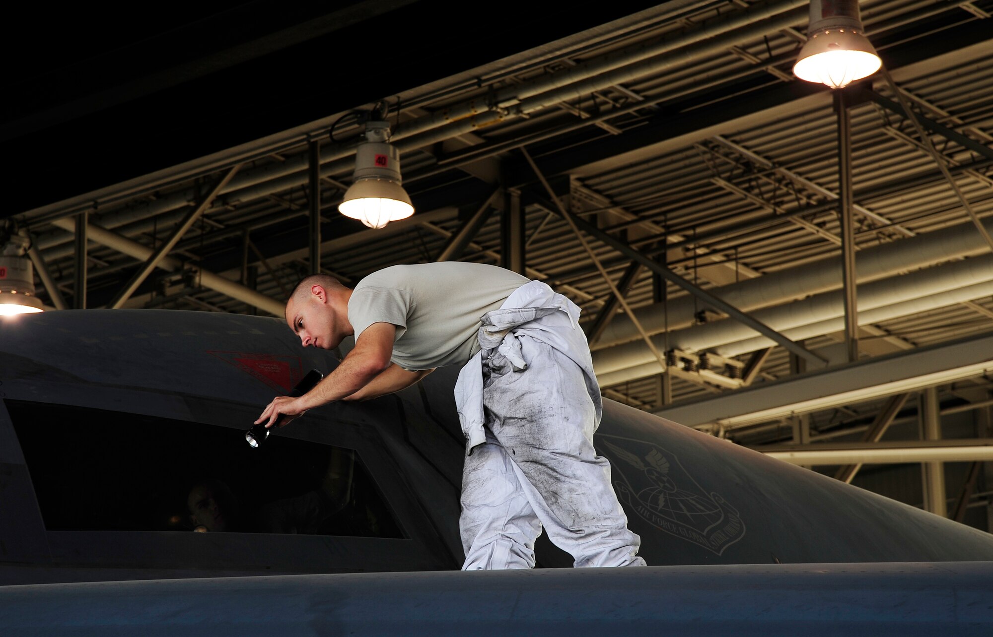 Staff Sgt. Joseph Reames, 509th Aircraft Maintenance Squadron B-2 Spirit crew chief, inspects a B-2 for any damages or discrepancies during a Nuclear Operational Readiness Exercise at Whiteman Air Force Base, Mo., Aug. 29. The NORE tested the 509th Bomb Wing and its associated units on their readiness in generating aircraft and deploying them when called upon. It is also how Whiteman prepares for future Nuclear Operational Readiness Inspections. (U.S. Air Force photo/Senior Airman Cody H. Ramirez)