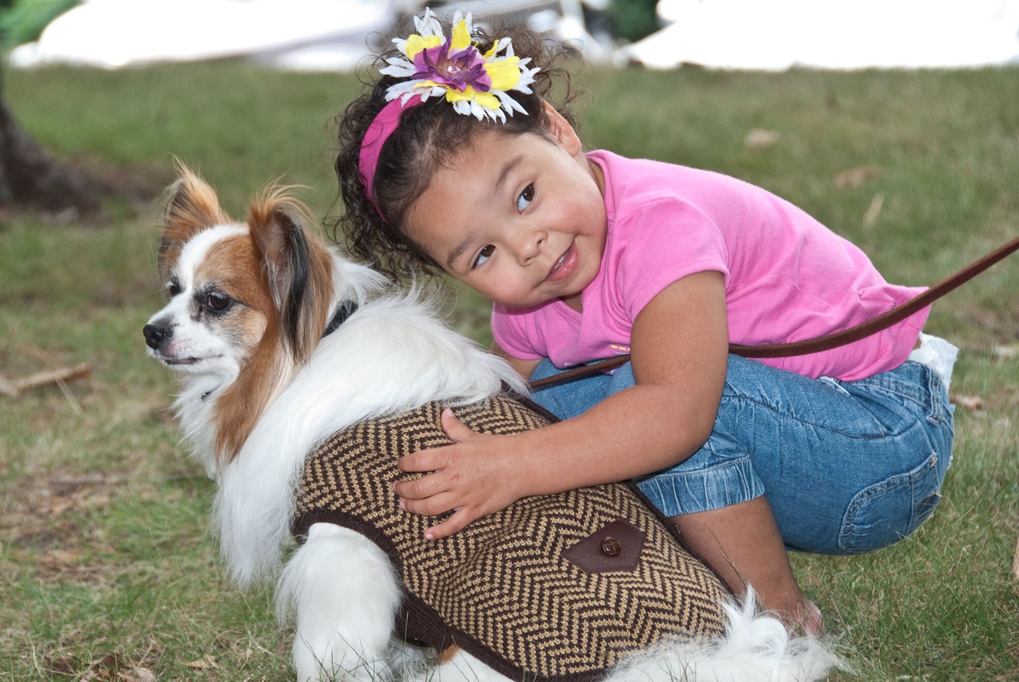 HANSCOM AIR FORCE BASE, Mass. –  Alexis Riley leans down to visit with Trudeau, one of the dogs participating in the Community Dog Show held outside the Minuteman Commons Aug. 25. This was the third annual dog show sponsored by the 66th Force Support Squadron. (U.S. Air Force photo by Mark Herlihy)