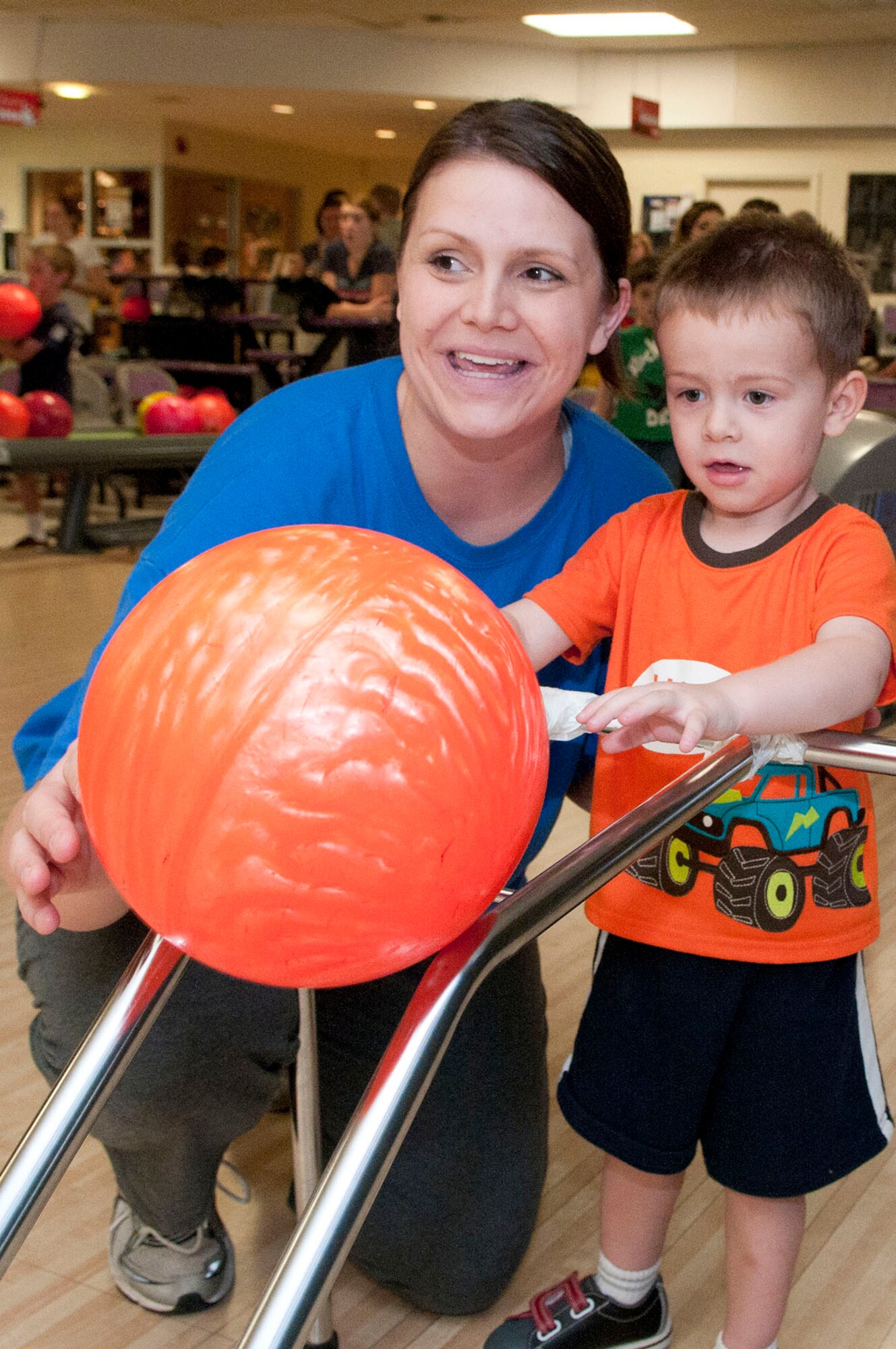 HANSCOM AIR FORCE BASE, Mass. - Megan Haile and her son, Matthew, bowl during a Hearts Apart event at Hanscom Lanes Aug. 22. Families of deployed, remote tour and extended TDY servicemembers were invited for an evening of food and fun at the bowling alley. (U.S. Air Force photo by Mark Wyatt)