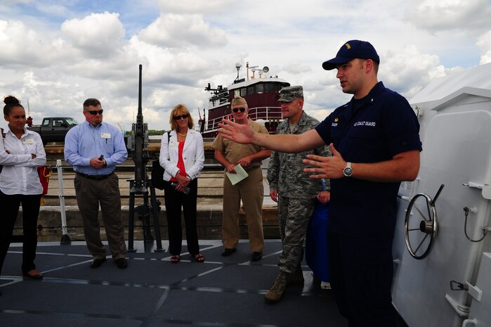 Lieutenant junior grade Andy Daum, Coast Guard Cutter Yellowfin commanding officer, briefs members of the South Carolina Military Task Force and base leadership, Aug. 22, 2012, on the U.S.Coast Guard Cutter Yellowfin at Joint Base Charleston – Weapons Station, S.C. The S.C. Military Base Task Force’s purpose is to enhance the value of military installations and facilities and the quality of life for military personnel located in South Carolina.  (U.S. Air Force photo/ Airman 1st Class Chacarra Walker)