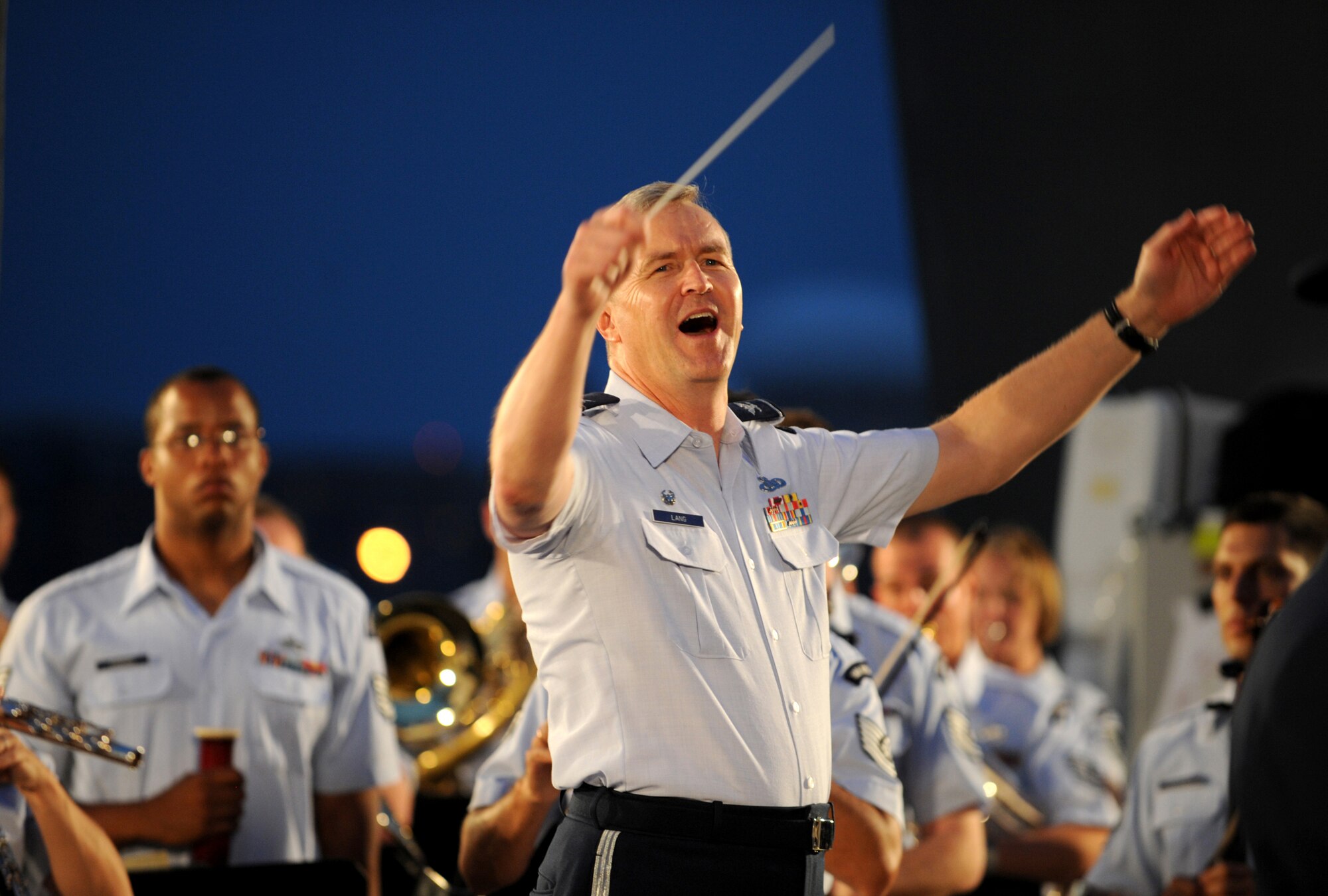 Col. Larry Lang conducts a concert at the Air Force Memorial in Washington, D.C., August 24, 2012 Throughout the summer months of June, July, and August, the band's performing ensembles present free outdoor concerts at historic venues in our nation's capital for Washington area residents, as well as for visitors from around the world. Land is the commander and conductor of the U.S. Air Force Band. (U.S. Air Force photo/Senior Airman Christina Brownlow)