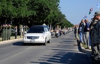 The remains of Sgt. Louis R. Torres were transported through Joint Base San Antonio Randolph Aug. 29. JBSA-Randolph?s Harmon Drive was lined with Randolph employees and family members paying final tribute to Torres as his remains were transported back to Ohio.  Torres was assigned to the 2nd Battalion, 3rd Infantry Regiment, 3rd Stryker Brigade Combat Team, 2nd Infantry Division at Joint Base Lewis-McChord.  He deployed to Afghanistan with his brigade in December 2011 for his second deployment in support of Operation Enduring Freedom.  He died Aug. 22 from wounds suffered after he encountered an enemy IED Aug. 6 in Kandahar.  (U.S. Air Force Photo by Don Lindsey)