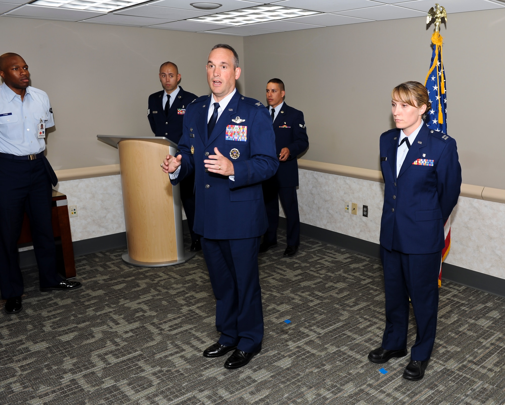Col. Brian Newberry, 92nd Air Refueling Wing commander, talks about the importance of real-life heroes like Capt. (Dr.) Leslee Kane, 92nd Medical Operations Squadron physician, who was awarded the Bronze Star Medal Aug. 27, 2012 at Fairchild Air Force Base, Wash., for her service during Operation Enduring Freedom at Provincial Reconstruction Team Zabul from June 2011 to March 2012. (U.S. Air Force photo by Senior Airman Benjamin Stratton)