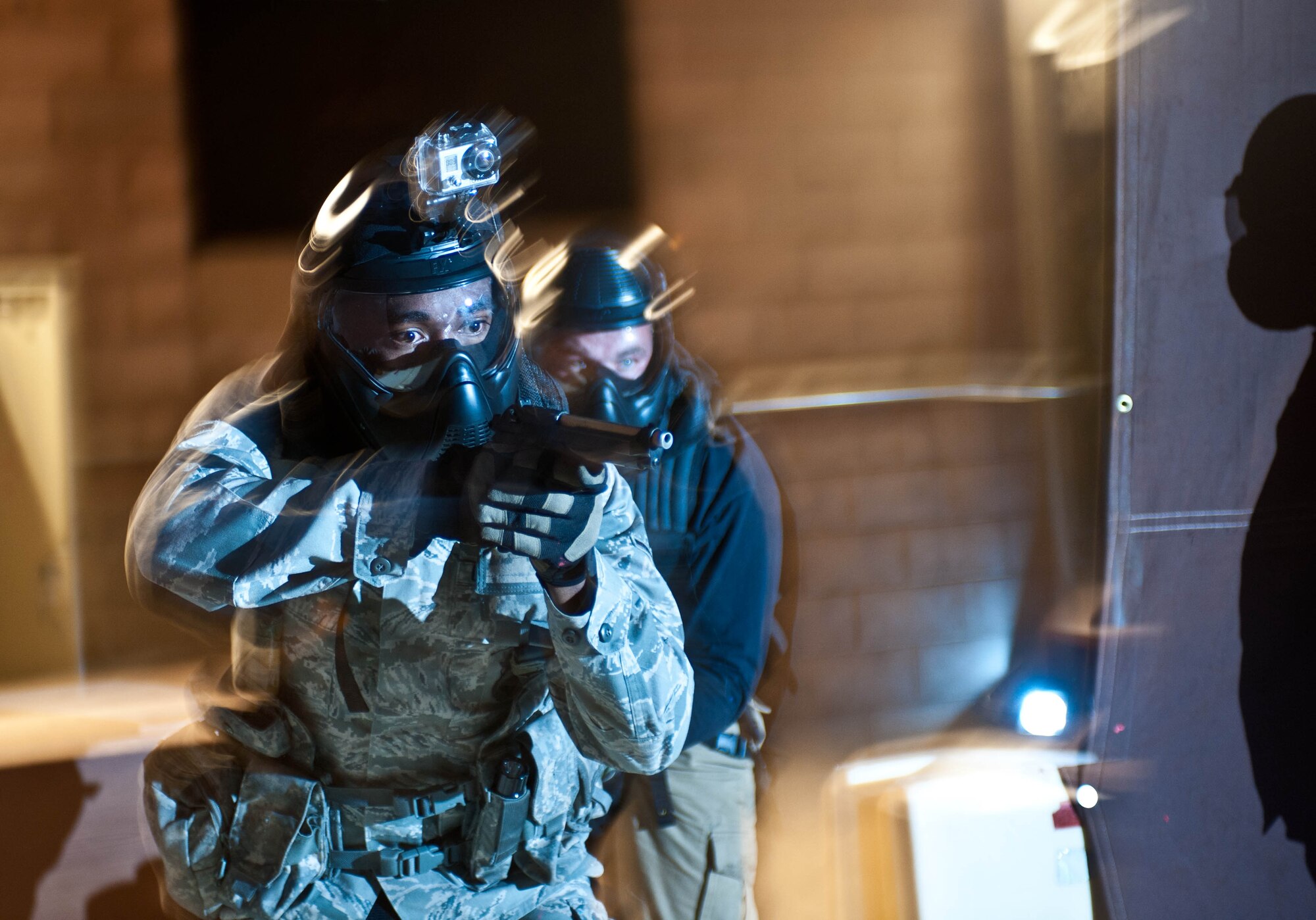 Airman Keith Leflore, and John Bisbee, 28th Security Forces squadron defenders, clear a simulated hostile environment during an active shooter exercise at Ellsworth Air Force Base, S.D., Aug. 24, 2012. Active Shooter situations normally last no more than 15 minutes, but can result in major loss of life. Defenders must be able to quickly respond in order to prevent further loss of life. (U.S. Air Force photo by Airman 1st Class Zachary Hada/Released)