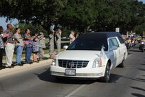 The remains of Sgt. Louis R. Torres were transported through Joint Base San Antonio-Randolph Aug. 29. JBSA-Randolph's Harmon Drive was lined with Randolph employees and family members paying final tribute to Torres as his remains were transported back to Ohio. Torres was assigned to the 2nd Battalion, 3rd Infantry Regiment, 3rd Stryker Brigade Combat Team, 2nd Infantry Division at Joint Base Lewis-McChord.  He deployed to Afghanistan with his brigade in December 2011 for his second deployment in support of Operation Enduring Freedom.  He died Aug. 22 from wounds suffered after he encountered an enemy IED Aug. 6 in Kandahar. (U.S. Air Force photo by Rich McFadden) 