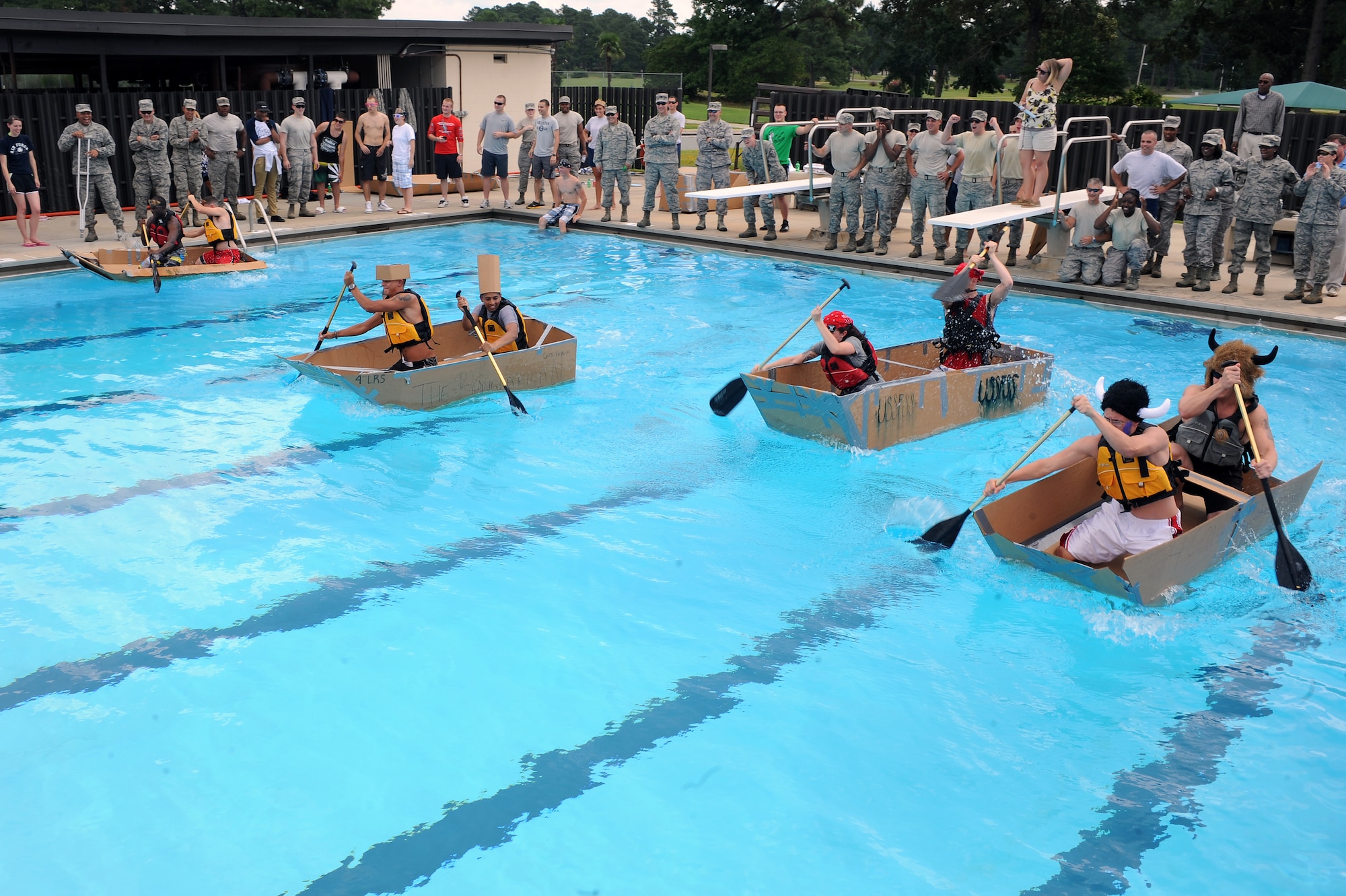 Airmen partake in a build-a-boat competition on Seymour Johnson Air Force Base, N.C., Aug. 22, 2012. More than 10 base organizations competed in the team event for a chance to win first prize. (U.S. Air Force photo/Airman 1st Class John Nieves Camacho/Released)