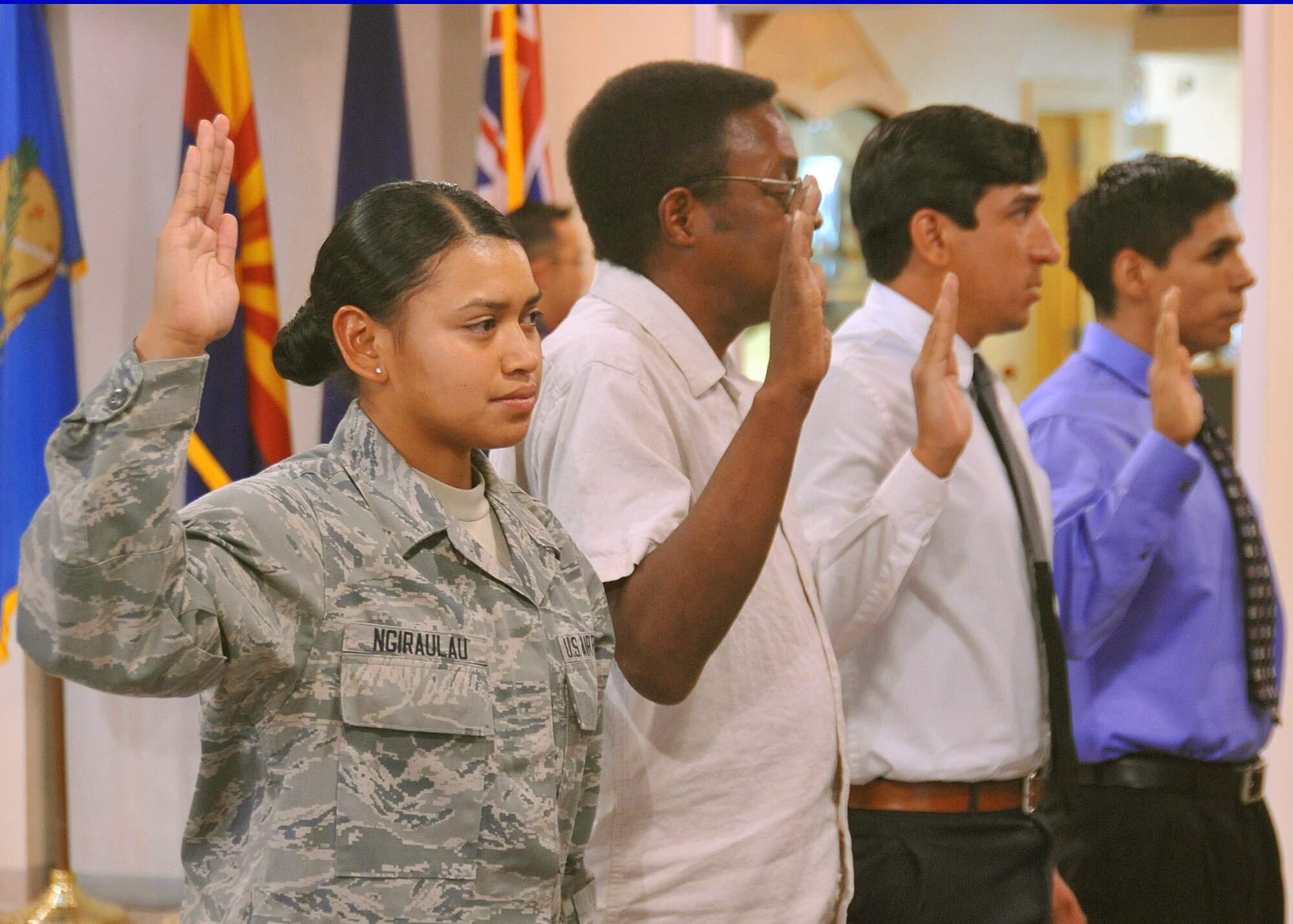 KIRTLAND AFB, N.M. -- Airman 1st Class Ngeluul Ngiraulau, 58th Special Operations Wing, was naturalized as a U.S. citizen Aug. 24 at the New Mexico Veterans Memorial. Ngiraulau was born in the Republic of Palau, but calls Reno, Nev., her hometown and has lived in the U.S. since she was 18 months old. Ngiraulau enlisted in the Air Force in May 2011. (Photo by Todd Berenger)