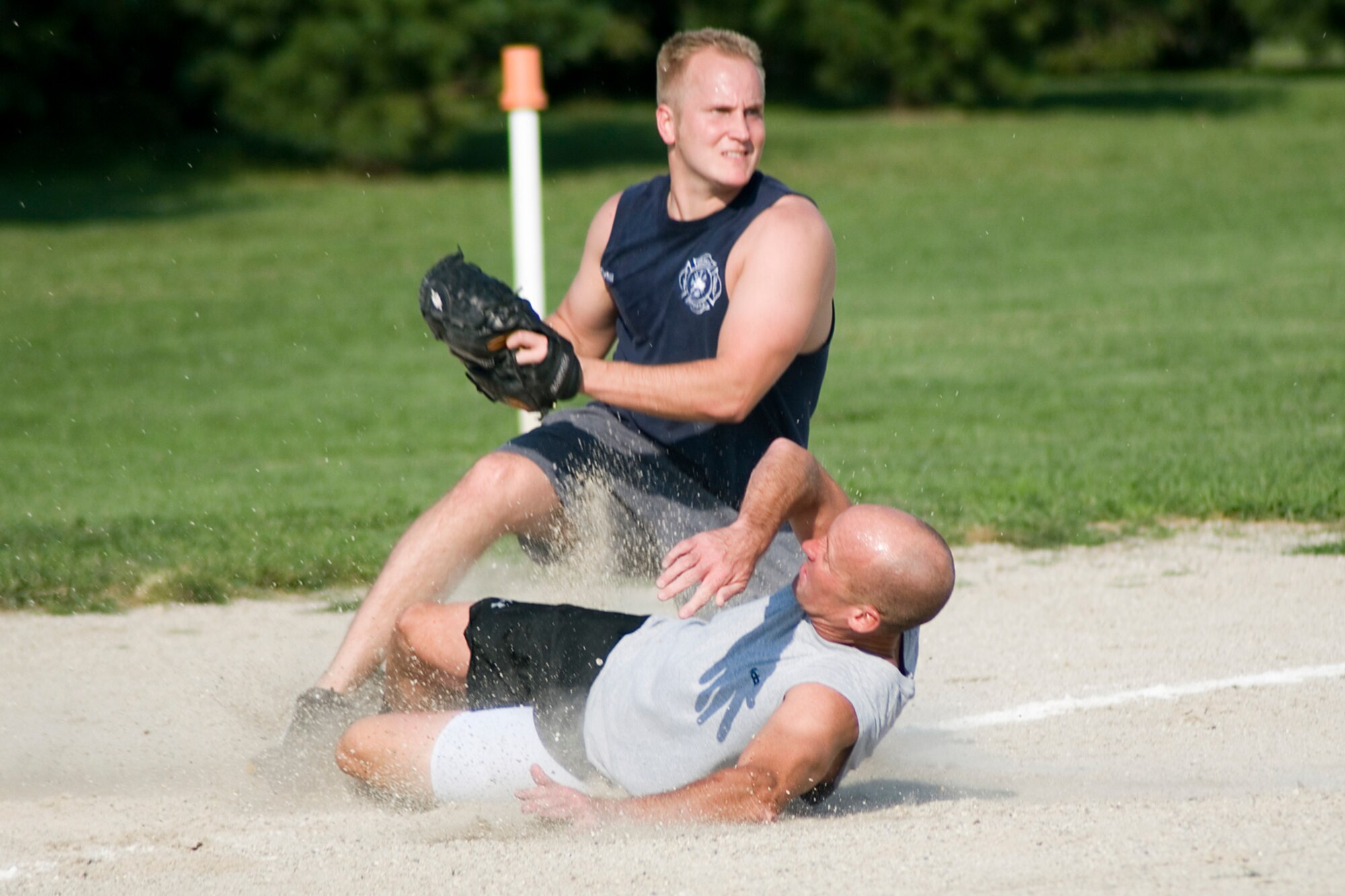 GRISSOM AIR RESERVE BASE; Ind. -- Gerry Conway, Grissom Ops, slides into third against Bennett Grove, Fire Dogs, during the intramural softball championship game here Aug. 15. Ops won the game 16-9. (U.S. Air Force photo by Senior Airman Andrew McLaughlin)