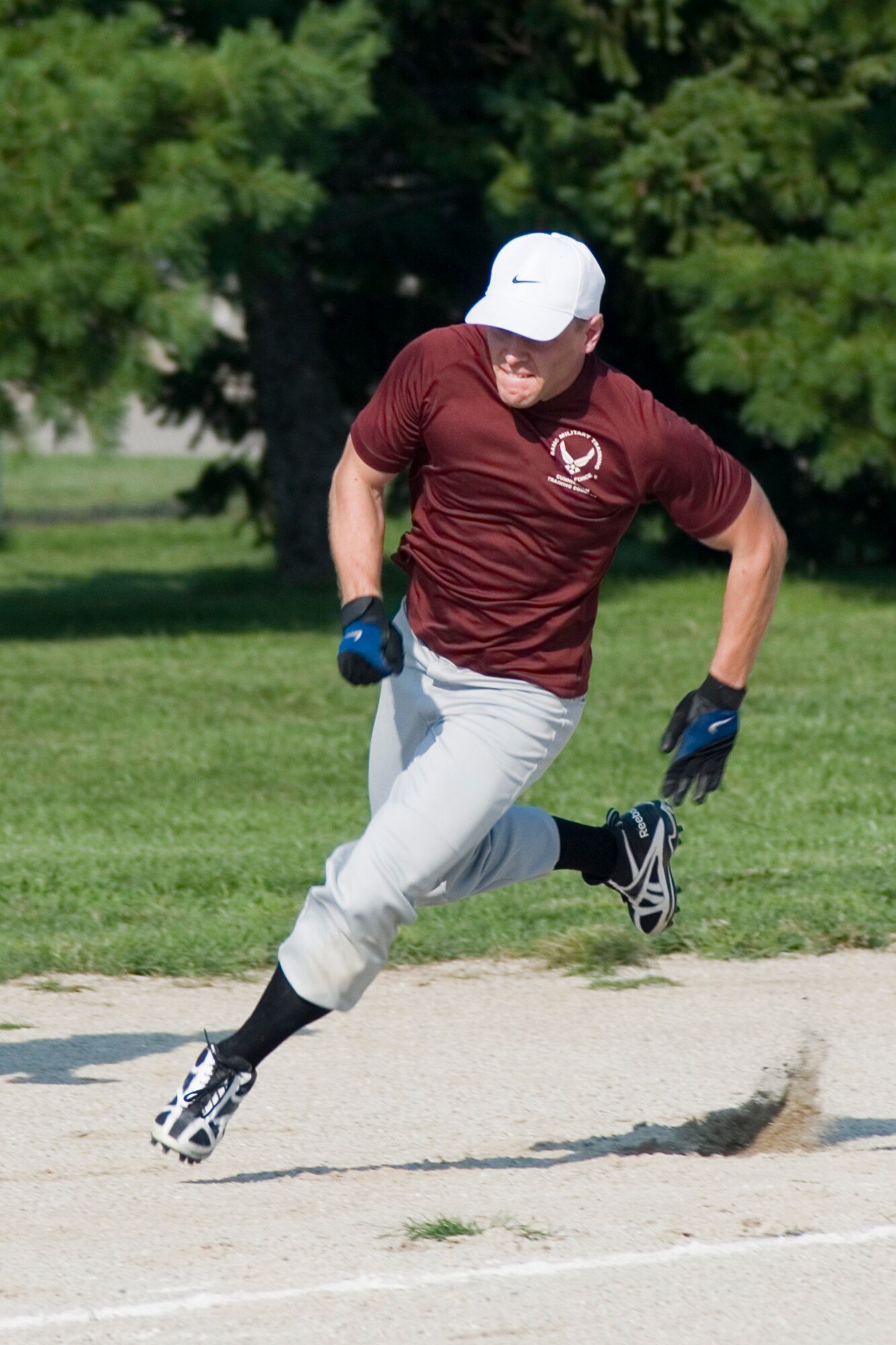 GRISSOM AIR RESERVE BASE, Ind. -- Craig Garrison, Grissom Ops, runs for home during the intramural softball championship game here Aug. 15. Ops took on the Grissom Fire Dogs and won 16-9. (U.S. Air Force photo by Senior Airman Andrew McLaughlin)
