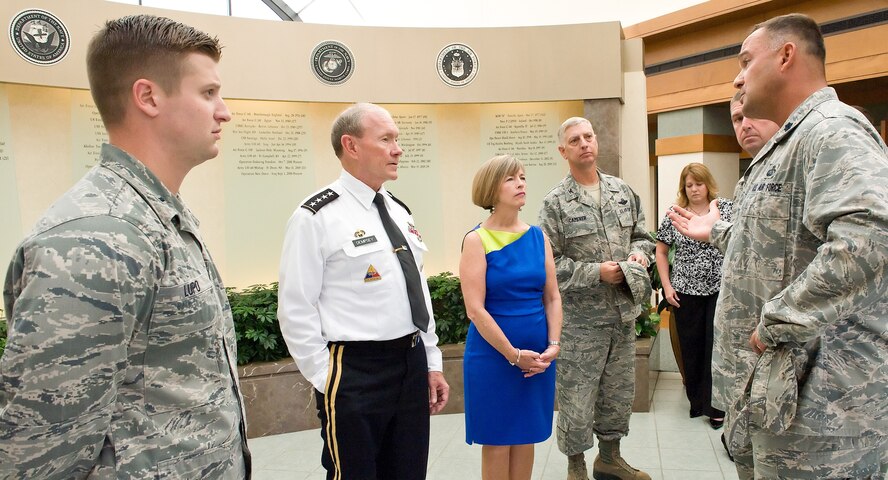 72
Air Force Lt. Col. David Kretz (Right), Air Force Mortuary Affairs Operations deputy commander, talks with Army Gen. Martin E. Dempsey, 18th Chairman of the Joint Chiefs of Staff, in the atrium of the Charles C. Carson Center for Mortuary Affairs, Dover Air Force Base, Del., Aug. 10, 2012. Dempsey met with the troops who support the sacred mission of honoring American's fallen heroes. (U.S. Air Force photo/Roland Balik)   
