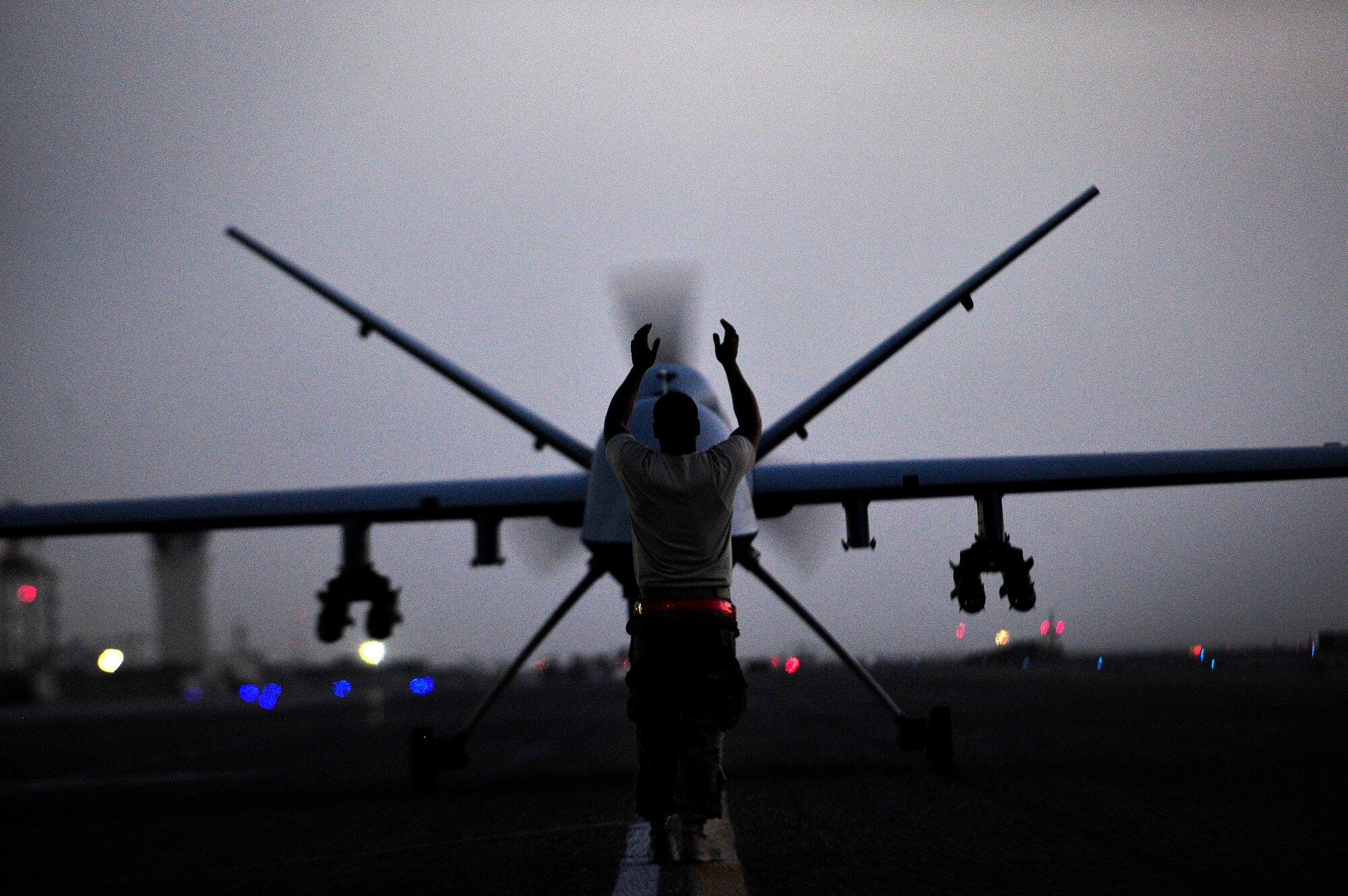 U.S. Air Force members of the 62nd Expeditionary Reconnaissance Squadron (ERS), a coalition squadron operated by U.S. and Royal Air Force (RAF) forces, taxi an MQ-9 Reaper, Kandahar Airfield, Afghanistan, June 25, 2012. The 62nd ERS mission is to launch and recover remotely piloted aircraft before handing over control to Creech Air Force Base, Nev. 
(U.S. Air Force photo/Staff Sgt. Clay Lancaster/ Released)
