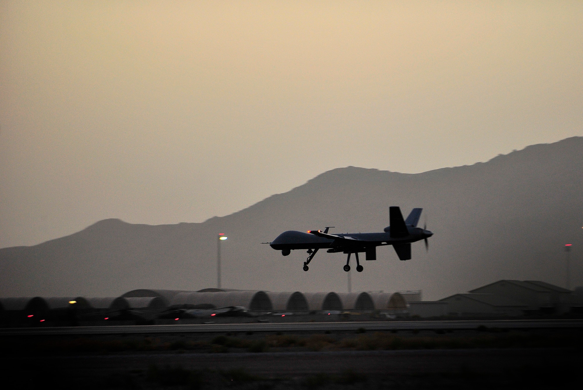 An MQ-9 Reaper remotely piloted aircraft, 62nd Expeditionary Reconnaissance Squadron, touches down at Kandahar Airfield, Afghanistan, June 25, 2012. The 62nd ERS mission is to launch and recover remotely piloted aircraft before handing over control to Creech Air Force Base, Nev. 

(U.S. Air Force photo/Staff Sgt. Clay Lancaster/ Released)

