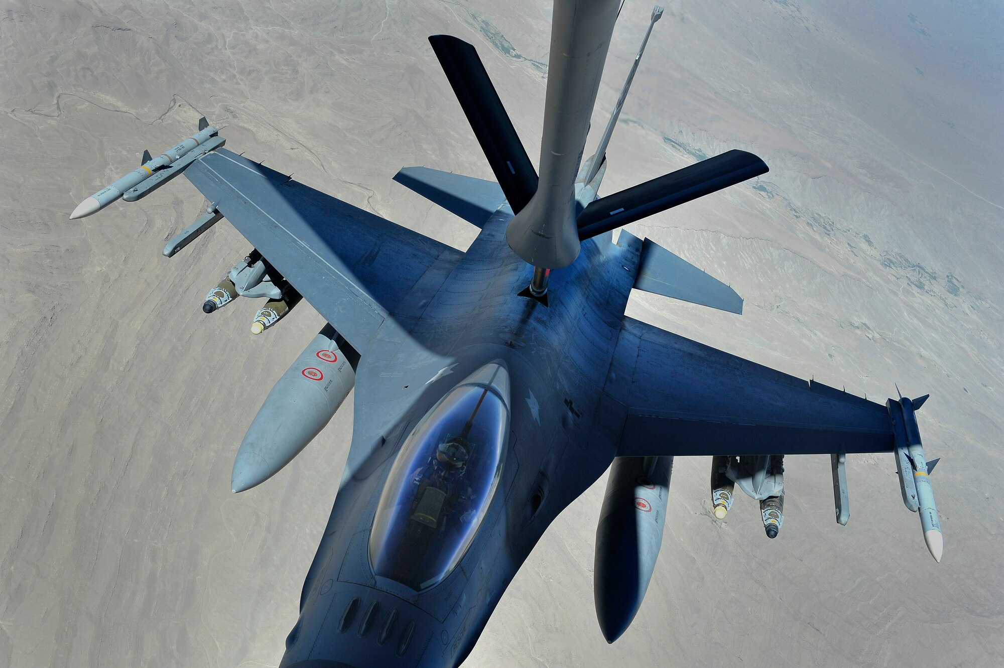 A U.S. Air Force F-16 Fighting Falcon (Viper)  is refueled over Afghanistan during overseas contingency operations, August 3, 2012. The 22d Expeditionary Air Refueling Sq. (EARS) conducts missions out of Transit Center at Manas, Kyrgyzstan, and plays an integral role in keeping air assets refueled in support of U.S. and coalition ground forces. 

(U.S. Air Force photo/Staff Sgt. Clay Lancaster/ Released)
