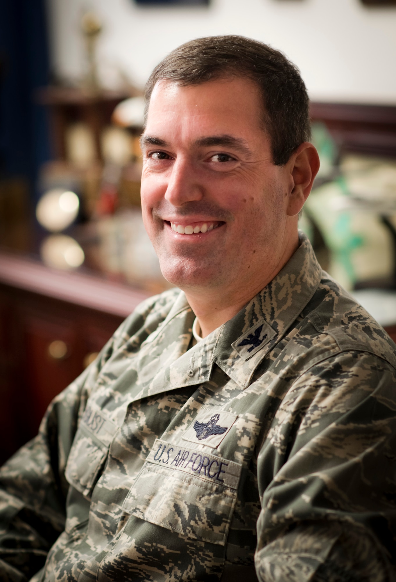 YOKOTA AIR BASE, Japan -- Col. Mark August, 374th Airlift Wing commander, poses for a photo in his office Aug. 29, 2012 at Yokota Air Base, Japan. August assumed command of the 374 AW on June 29, 2012, after an assignment as commander of the 386th Expeditionary Operations Group in Southwest Asia. (U.S. Air Force photo by Staff Sgt. Stacy Moless)